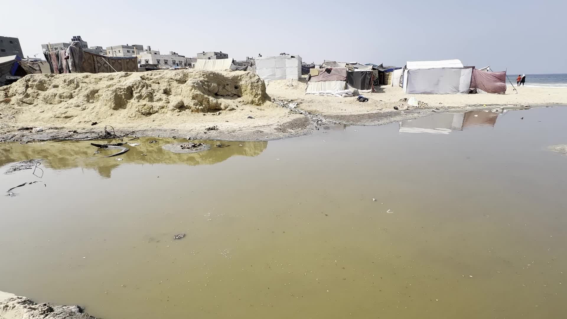 Displaced Palestinians Near Raw Sewage at Camp in Deir al-Balah, Gaza Strip