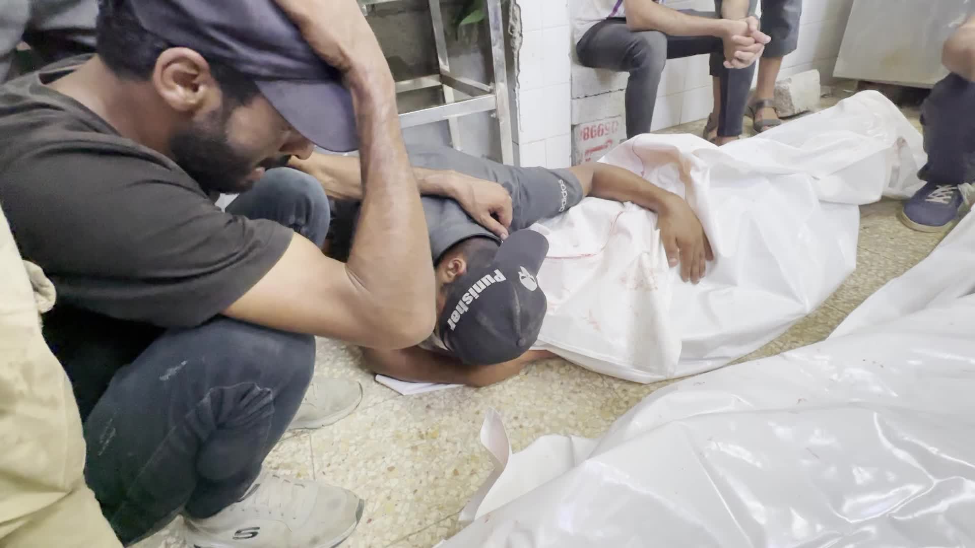 Palestinians Mourn Relatives Killed in Israeli Strike at Al-Aqsa Martyrs Hospital