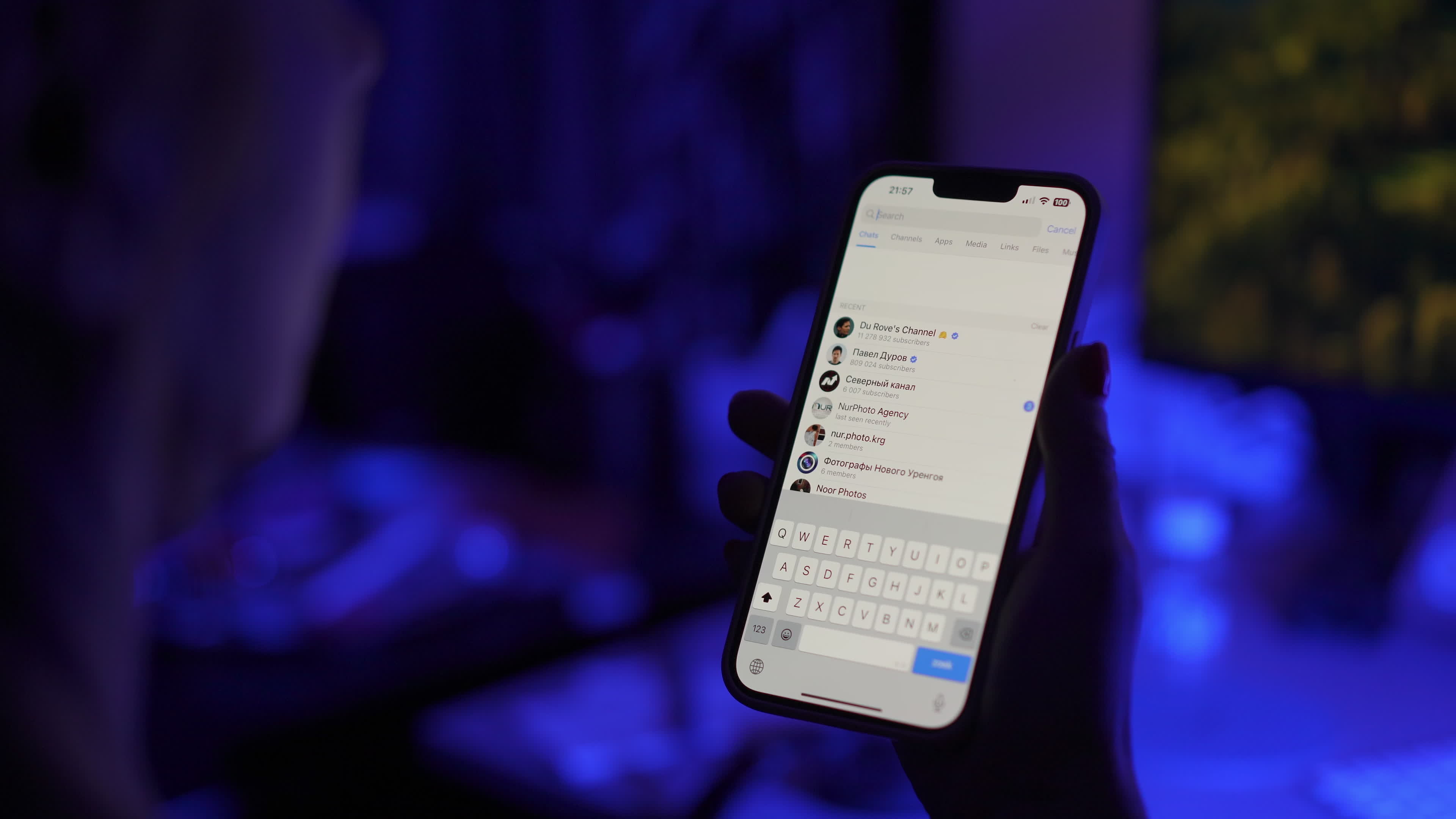 User with Telegram Messaging App on a Mobile Device
