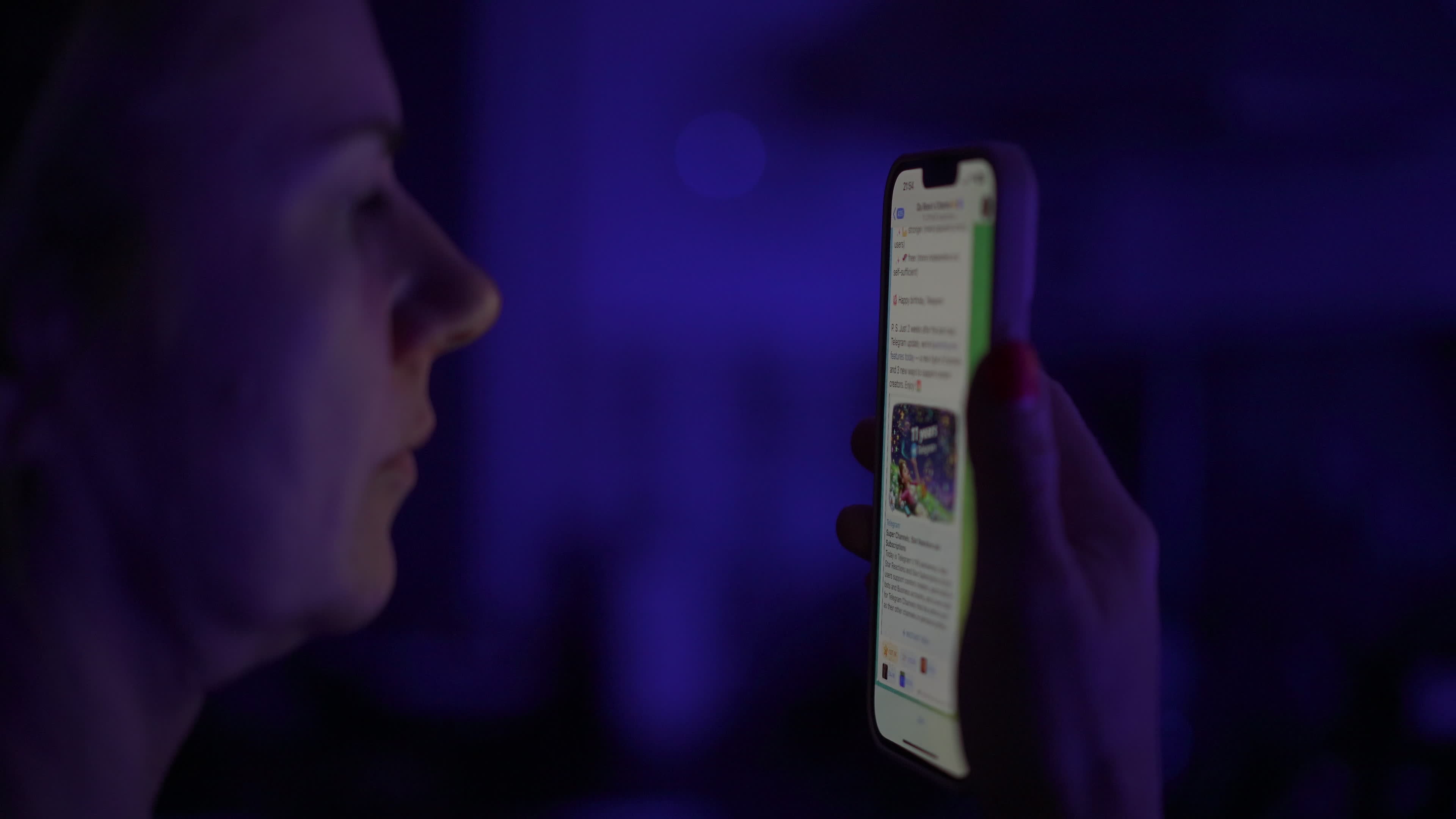 User with Telegram Messaging App on a Mobile Device