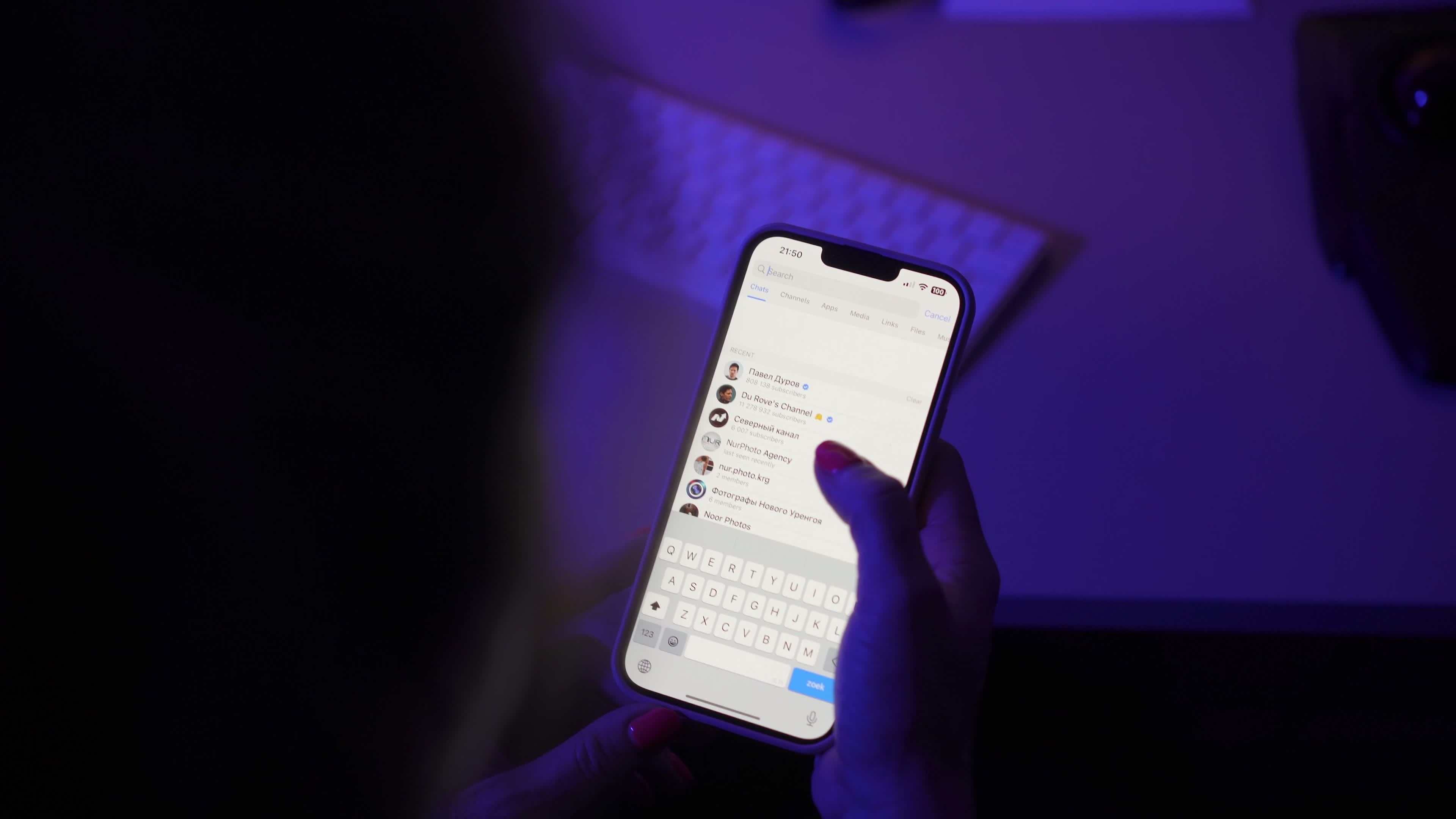User with Telegram Messaging App on a Mobile Device