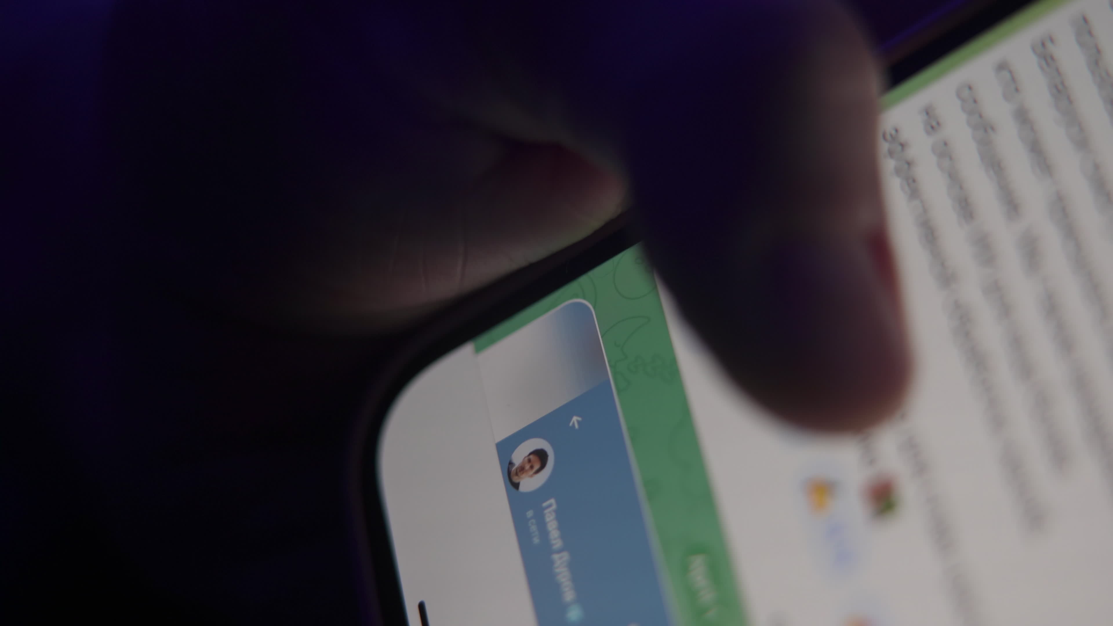 User with Telegram Messaging App on a Mobile Device