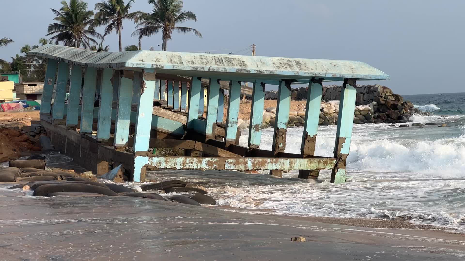 Platform destroyed by the strong ocean tides along Paruthiyoor Beach