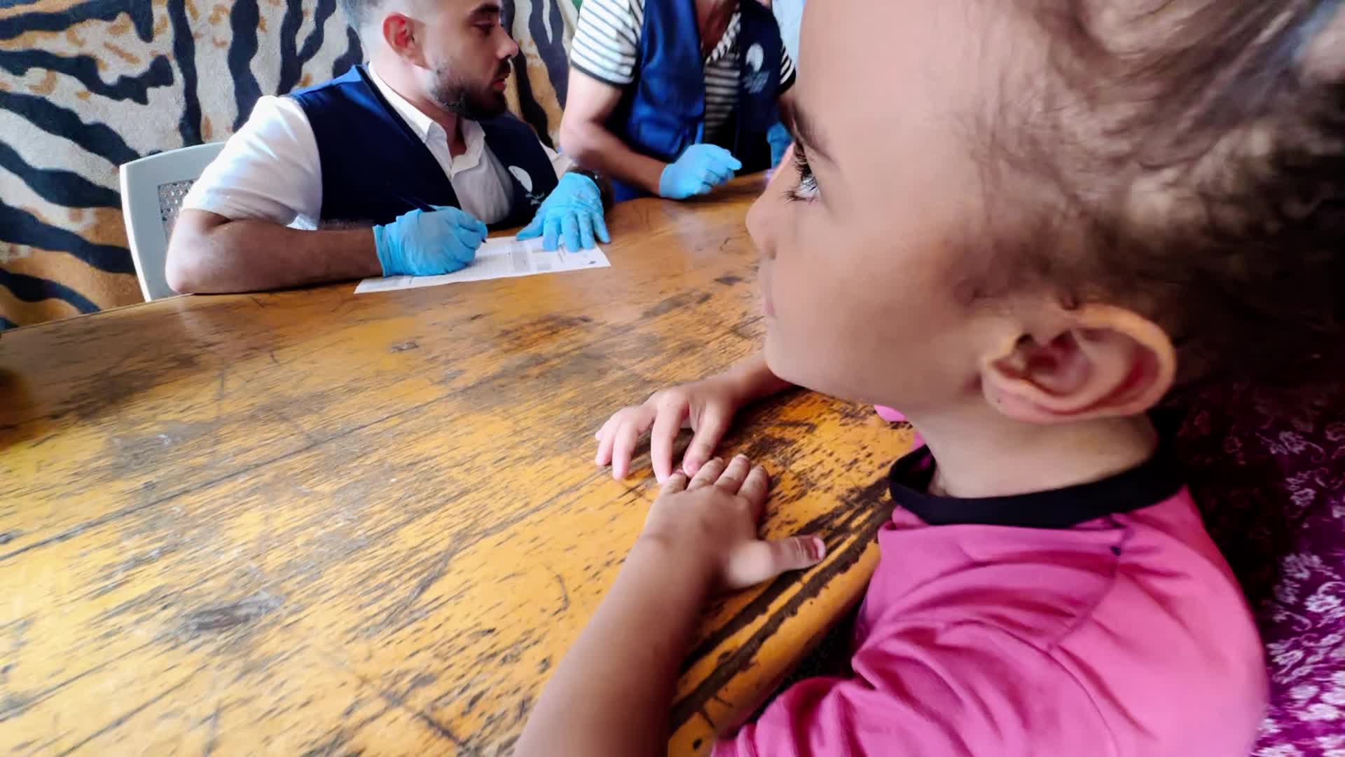 Palestinian Child Receives Polio Vaccination Amid Hamas-Israel Conflict