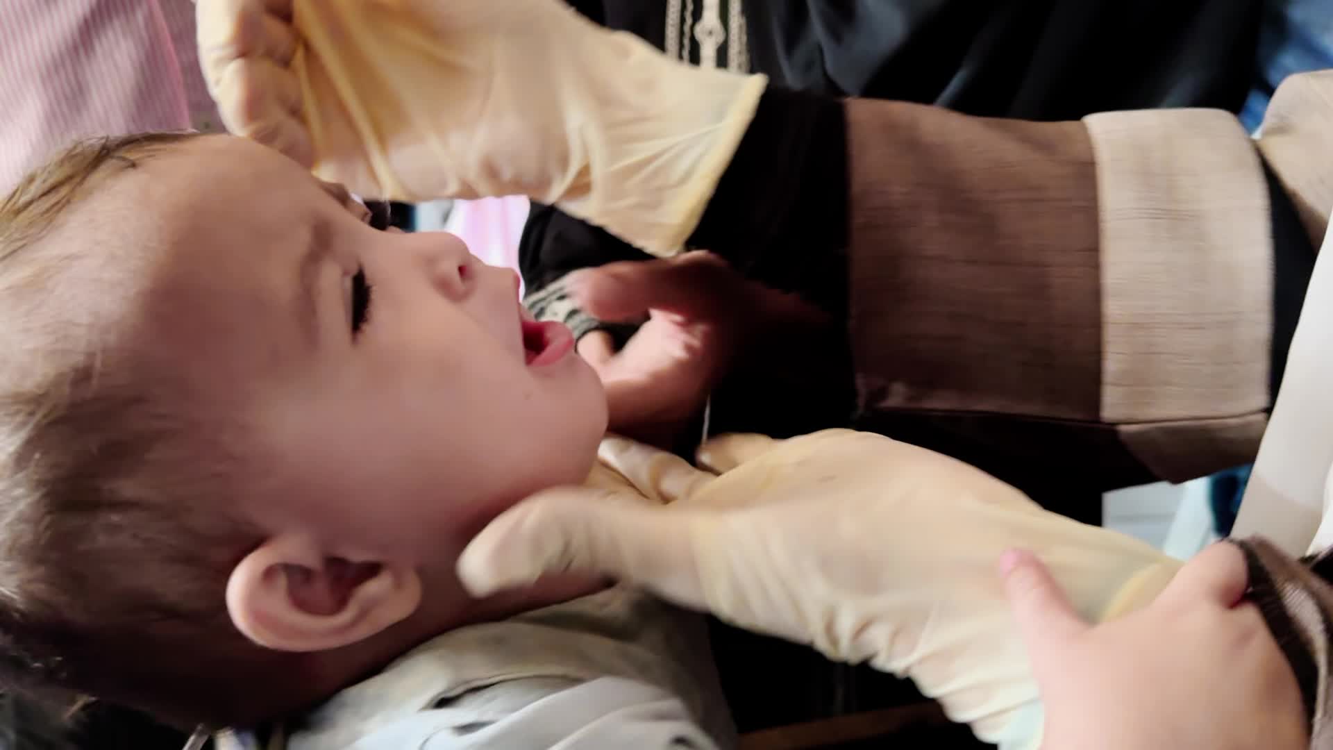 Palestinian Child Receives Polio Vaccination Amid Hamas-Israel Conflict