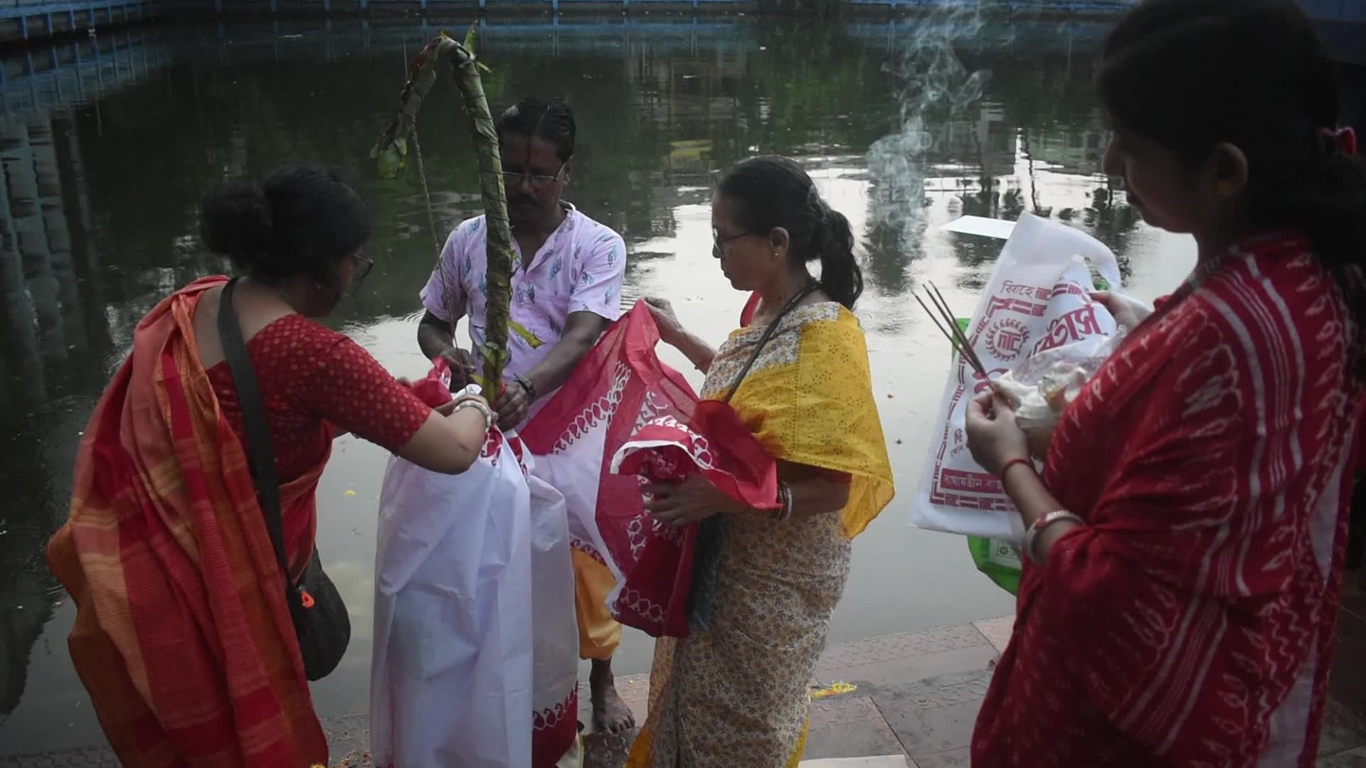 Devotees performing Nabapatrika ritual on the occasion of the Durga Puja festival in Kolkata, India