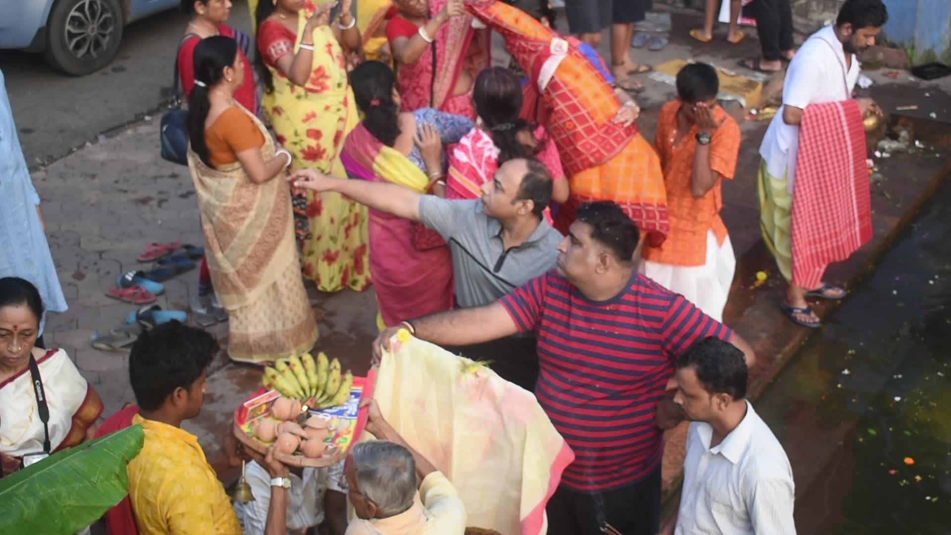 Devotees performing Nabapatrika ritual on the occasion of the Durga Puja festival in Kolkata, India