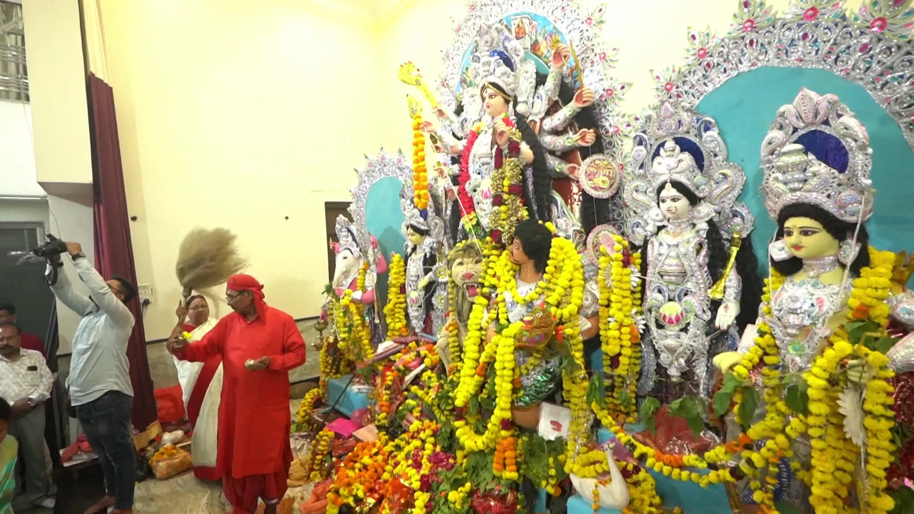Indian Devotees performs religious ritual in front of an idol of the goddess Durga during the 'Durga Puja' festival in Ajmer