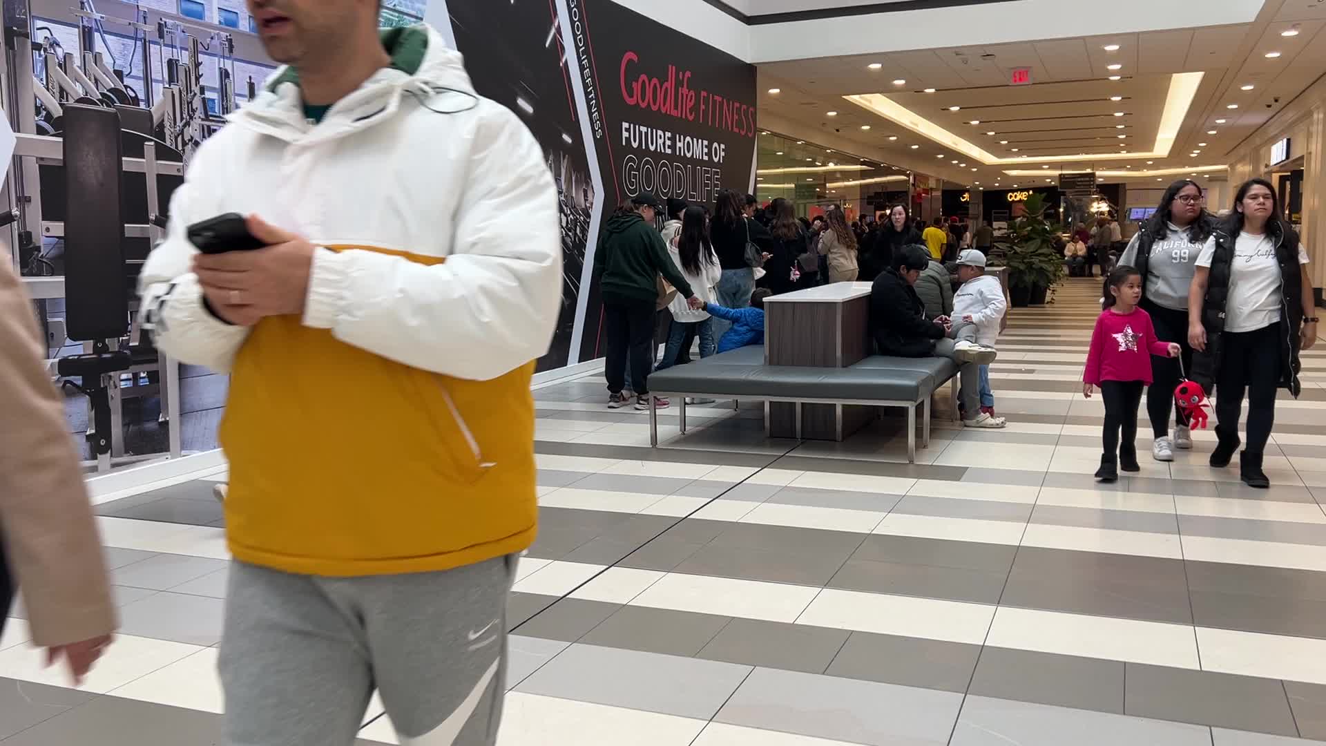 Huge line-up to enter a shop selling Halloween costumes and decorations in Toronto