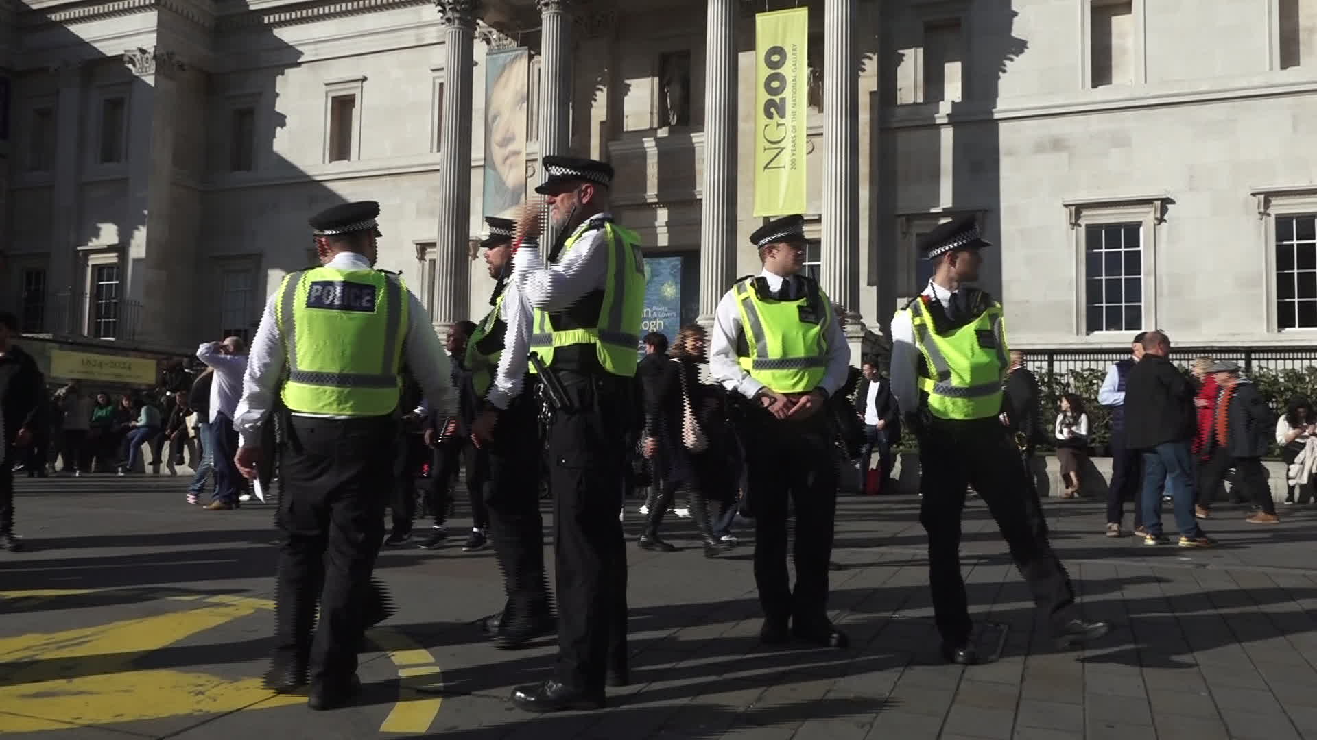 Protesters hold pro-Palestine placards during the demonstration in London