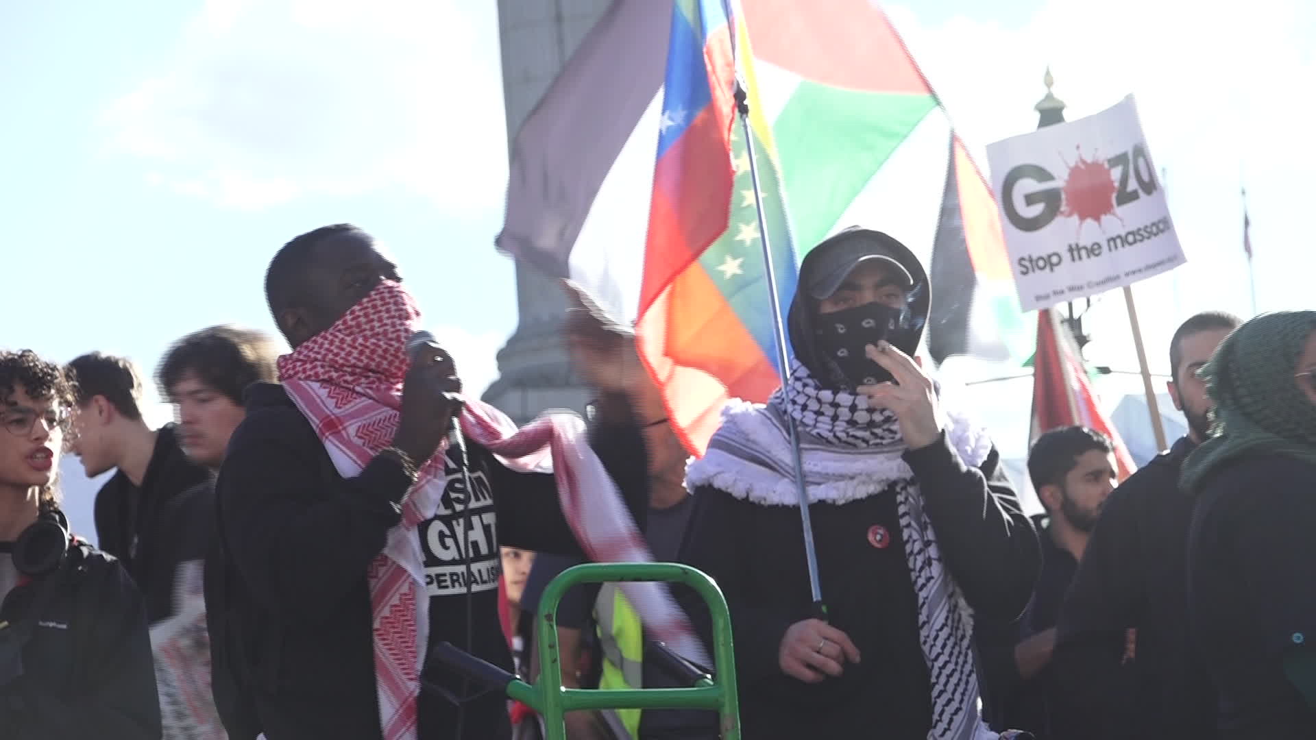 Protesters hold pro-Palestine placards during the demonstration in London