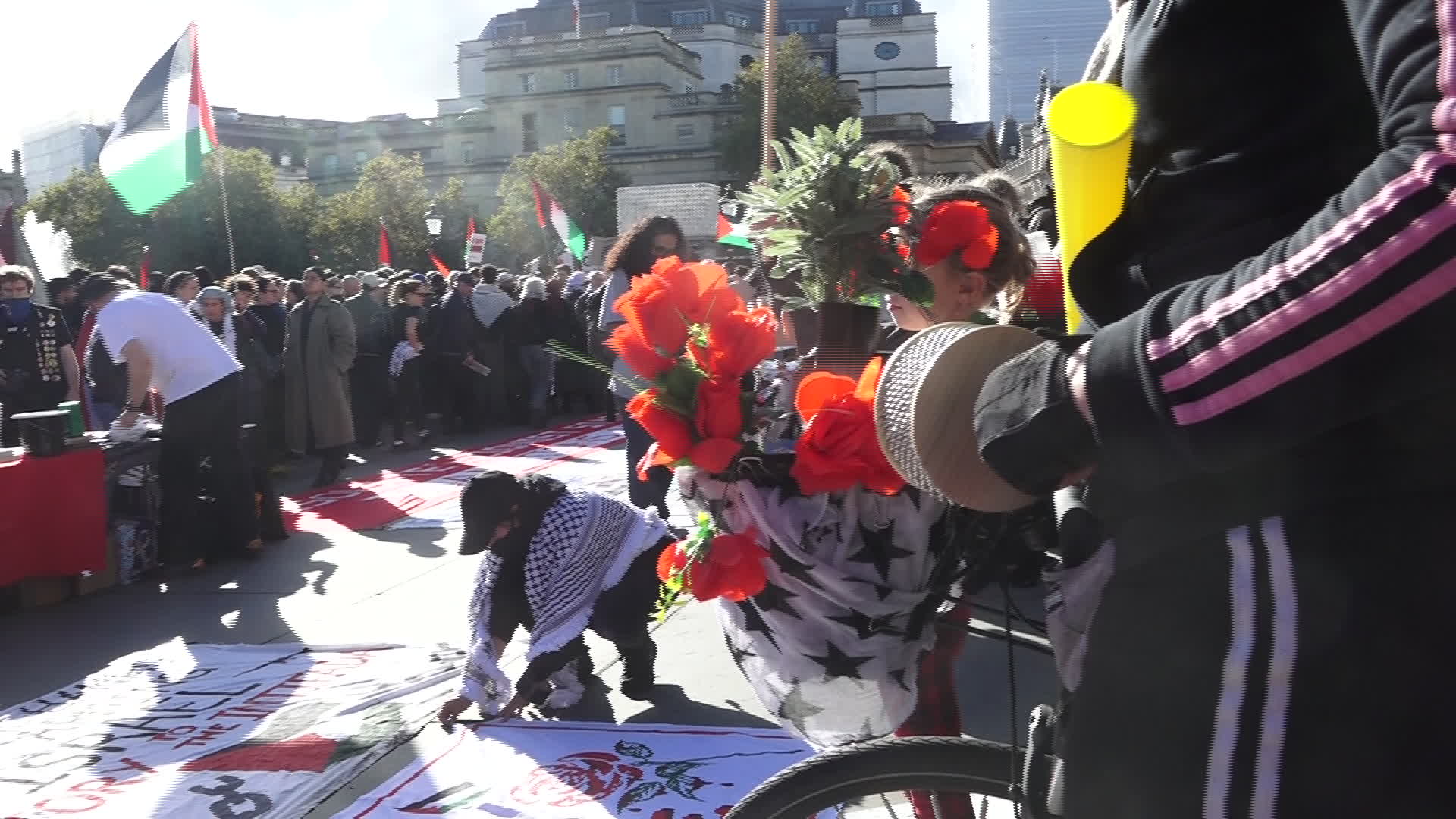 Protesters hold pro-Palestine placards during the demonstration in London