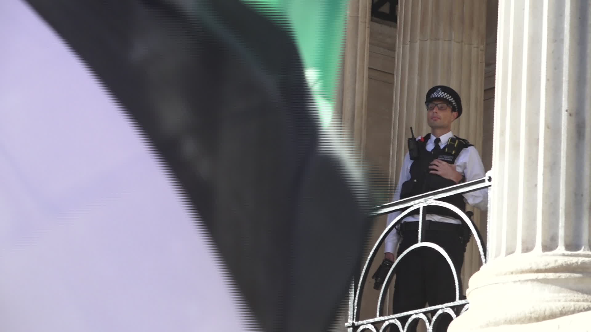Protesters hold pro-Palestine placards during the demonstration in London