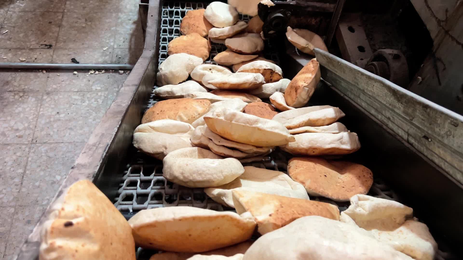 Palestinians Queue for Bread in Khan Yunis Amid Gaza Conflict
