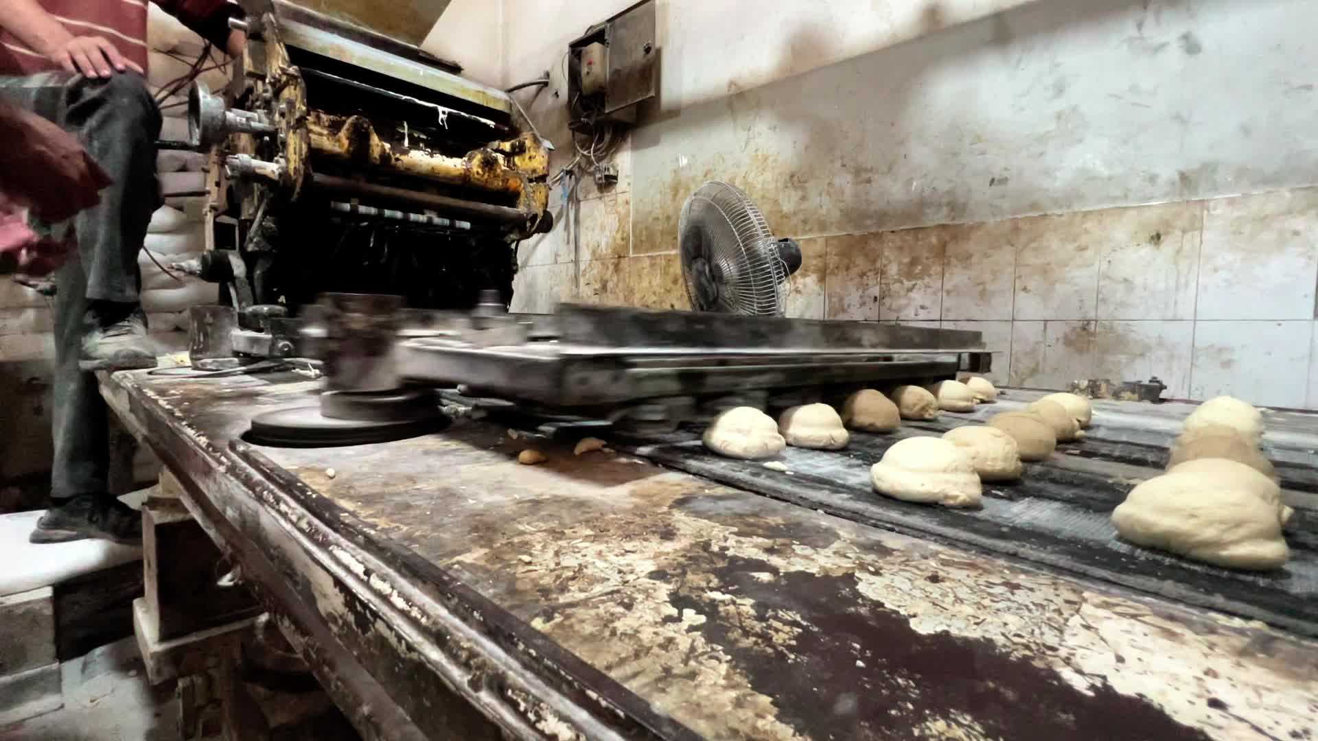 Palestinians Queue for Bread in Khan Yunis Amid Gaza Conflict