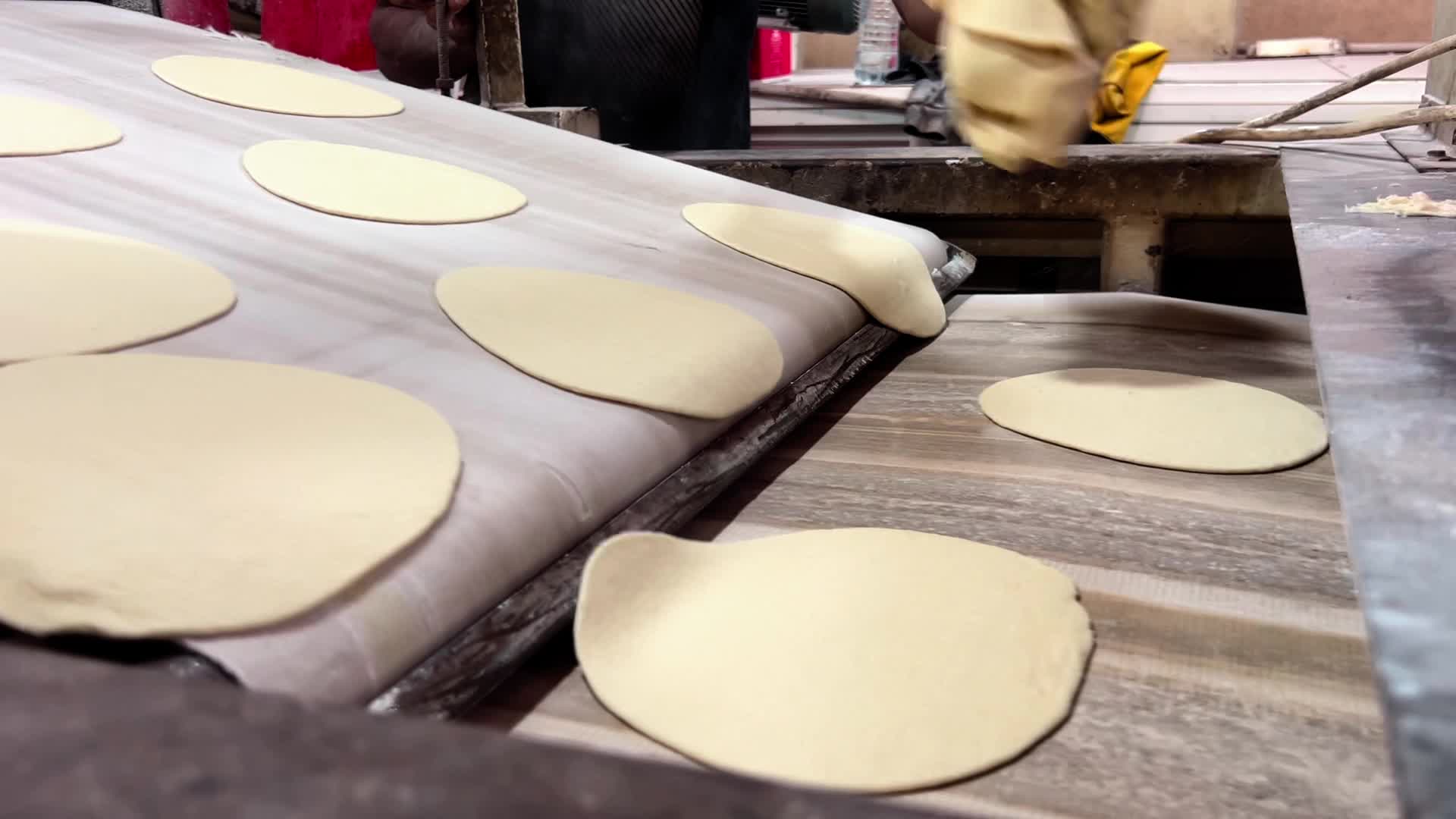 Palestinians Queue for Bread in Khan Yunis Amid Gaza Conflict