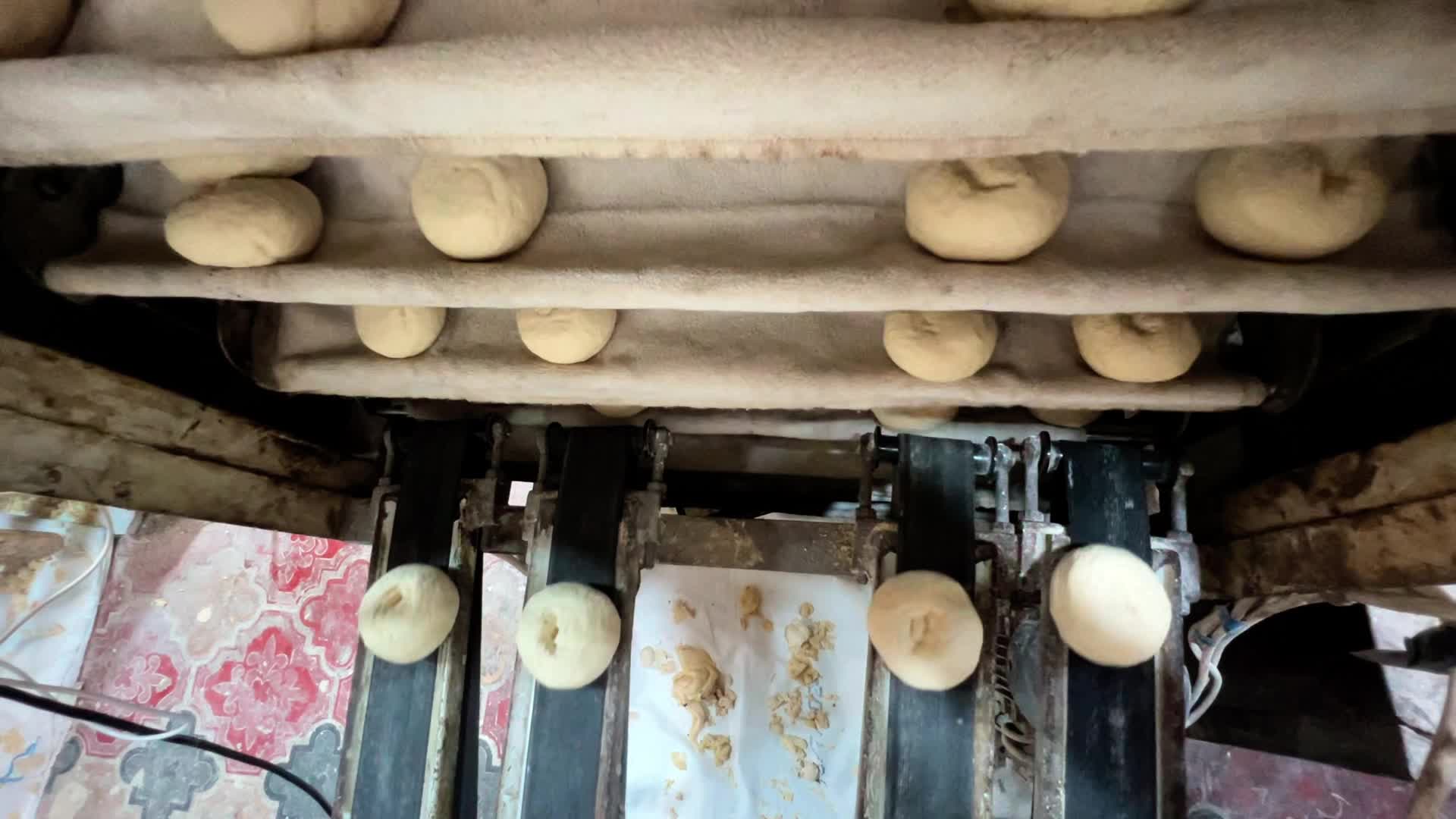 Palestinians Queue for Bread in Khan Yunis Amid Gaza Conflict