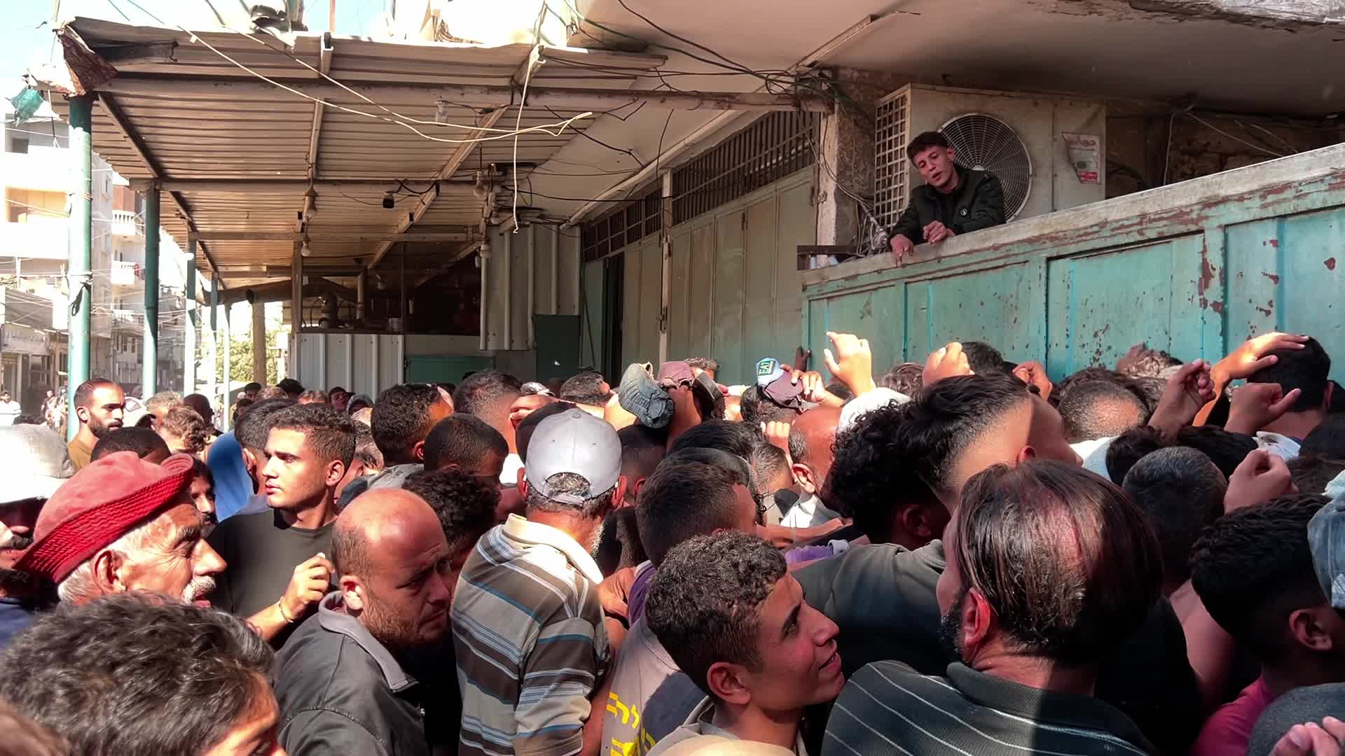 Palestinians Queue for Bread in Khan Yunis Amid Gaza Conflict