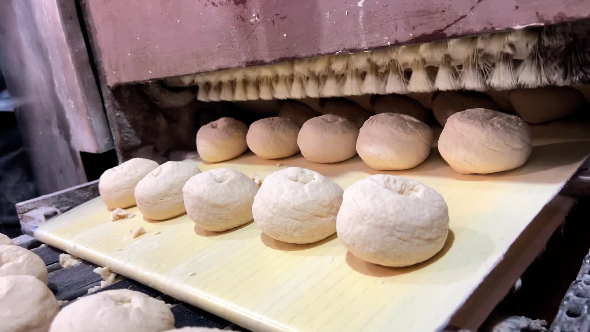 Palestinians Queue for Bread in Khan Yunis Amid Gaza Conflict