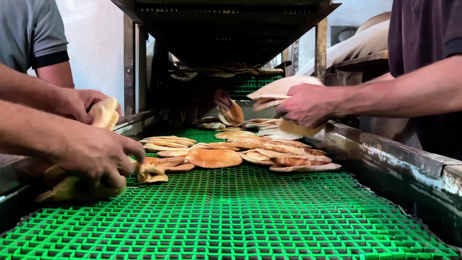 Palestinians Queue for Bread in Khan Yunis Amid Gaza Conflict