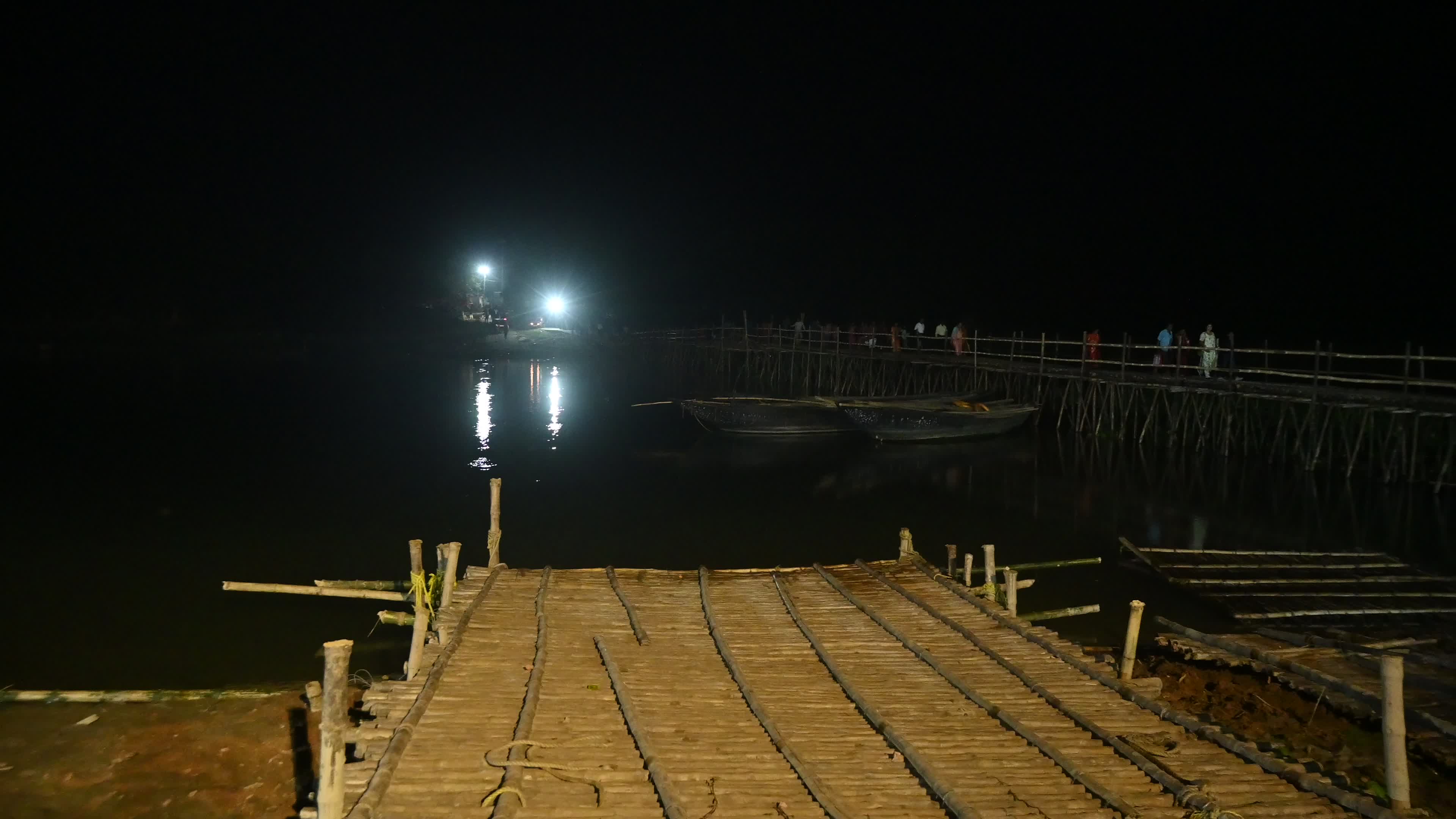 Village Scene at night on the bamboo bridge
