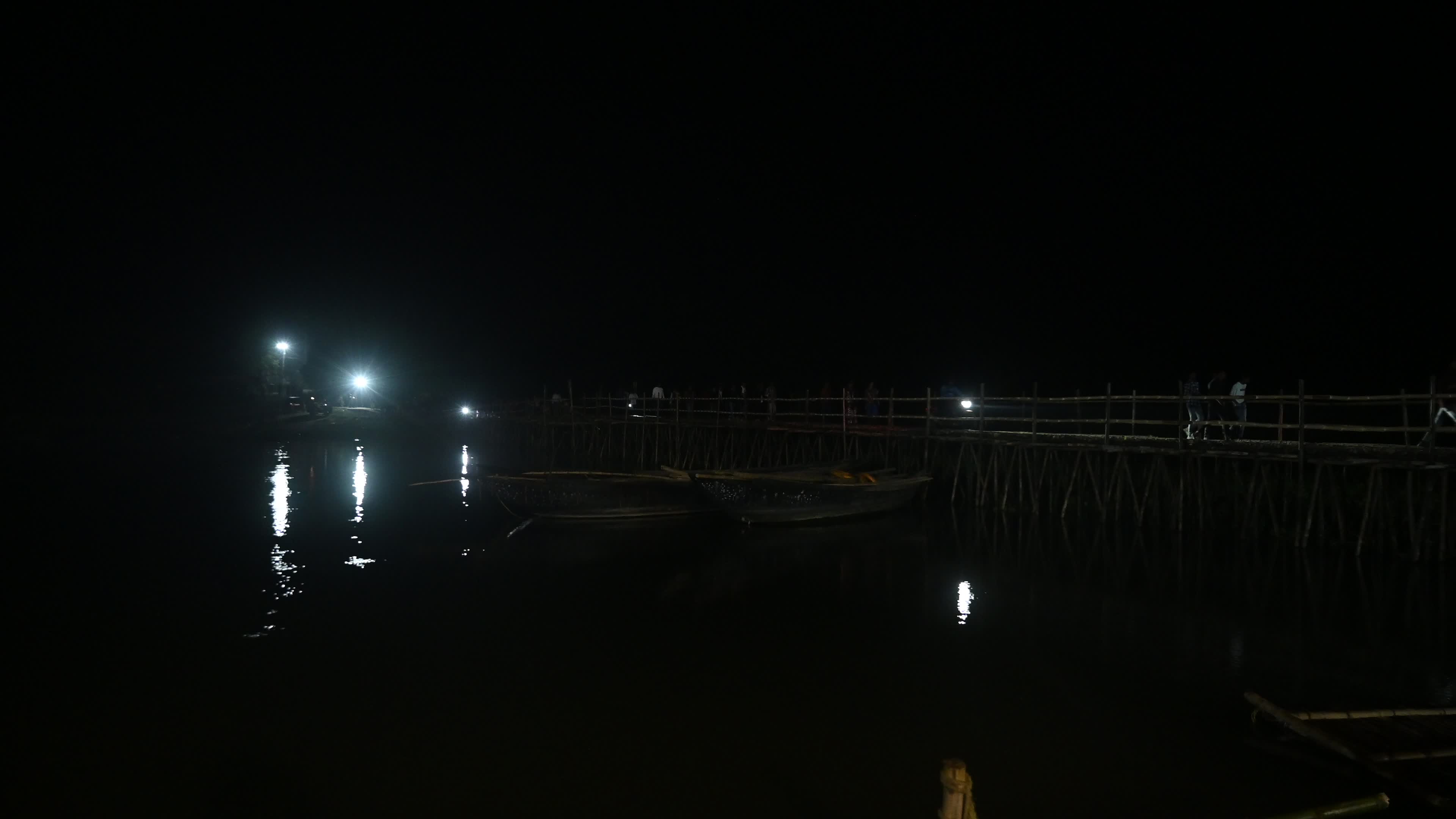 Village Scene at night on the bamboo bridge
