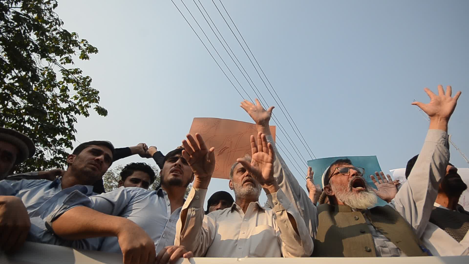 Shiite Muslims protest against attack on passenger vehicles that killed at least 40
