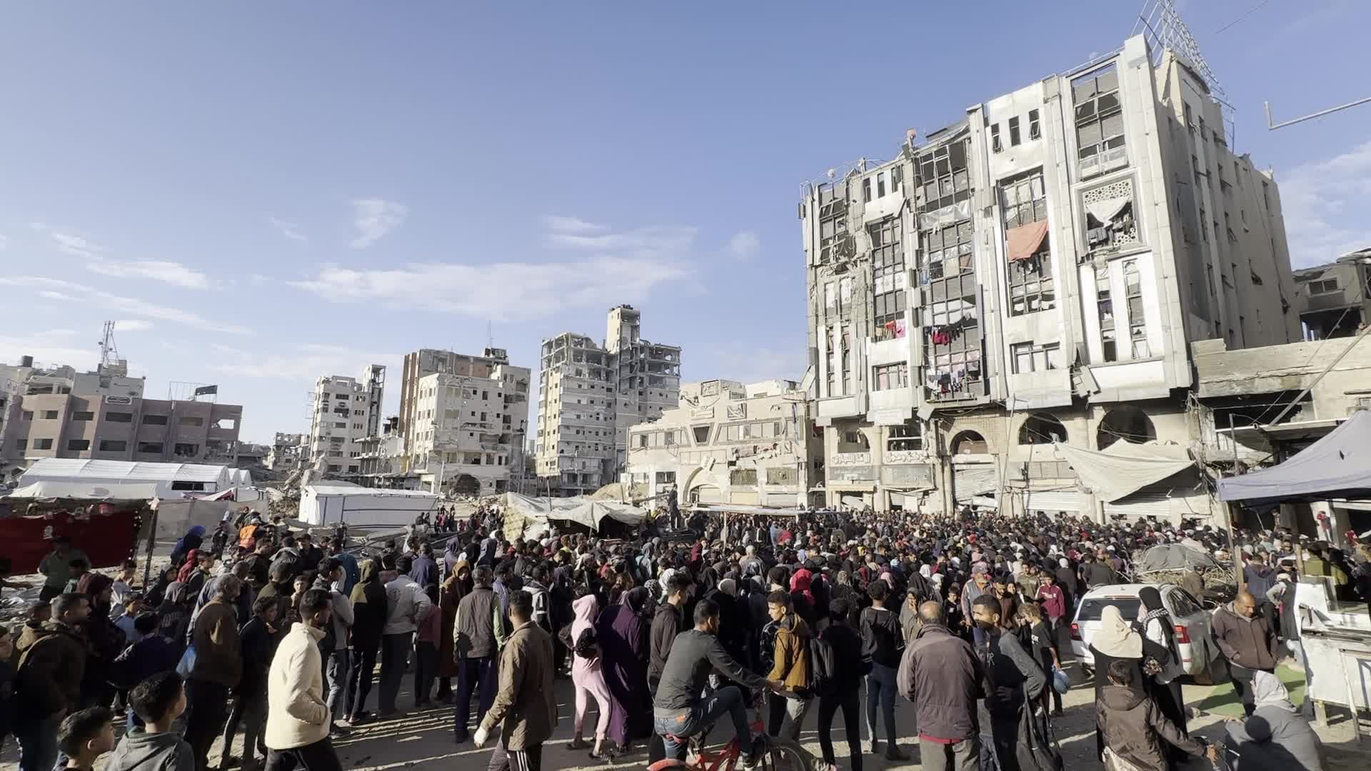 Palestinians Queue for Bread at Bakery in Khan Yunis Amid Gaza Conflict