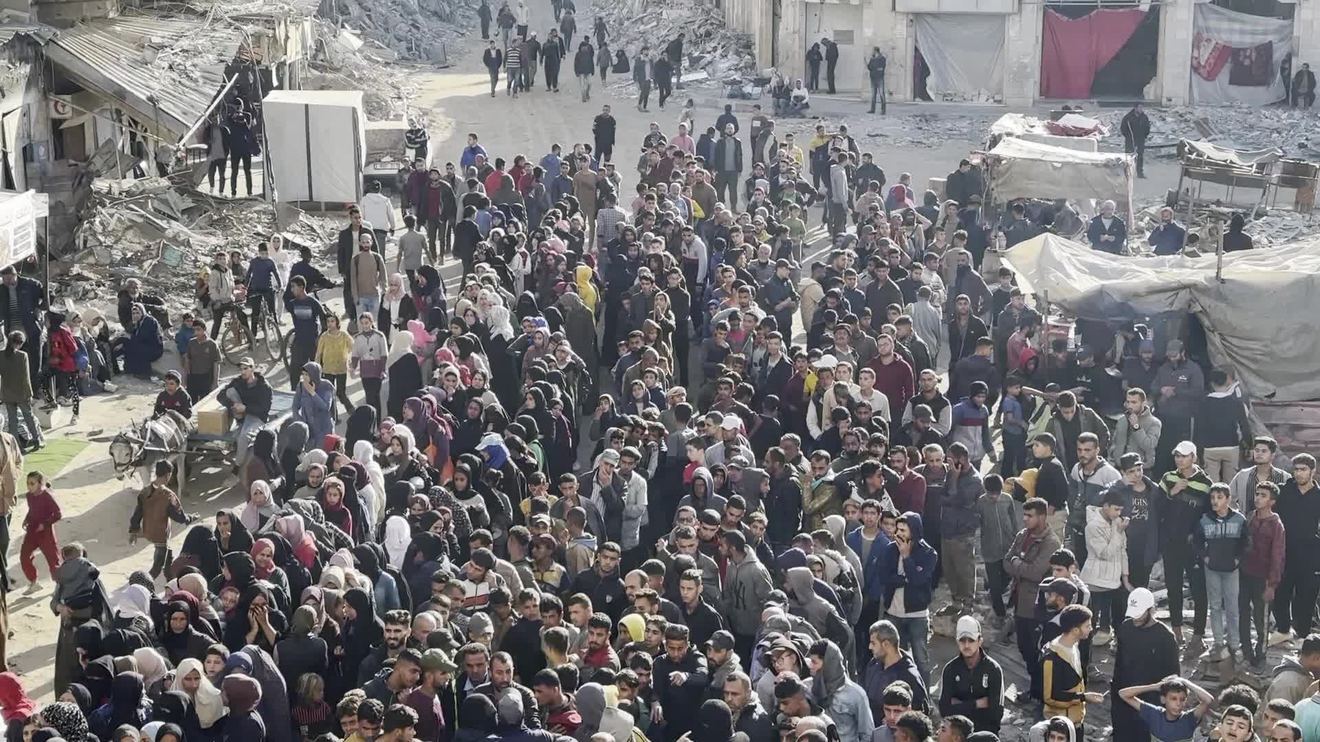 Palestinians Queue for Bread at Bakery in Khan Yunis Amid Gaza Conflict