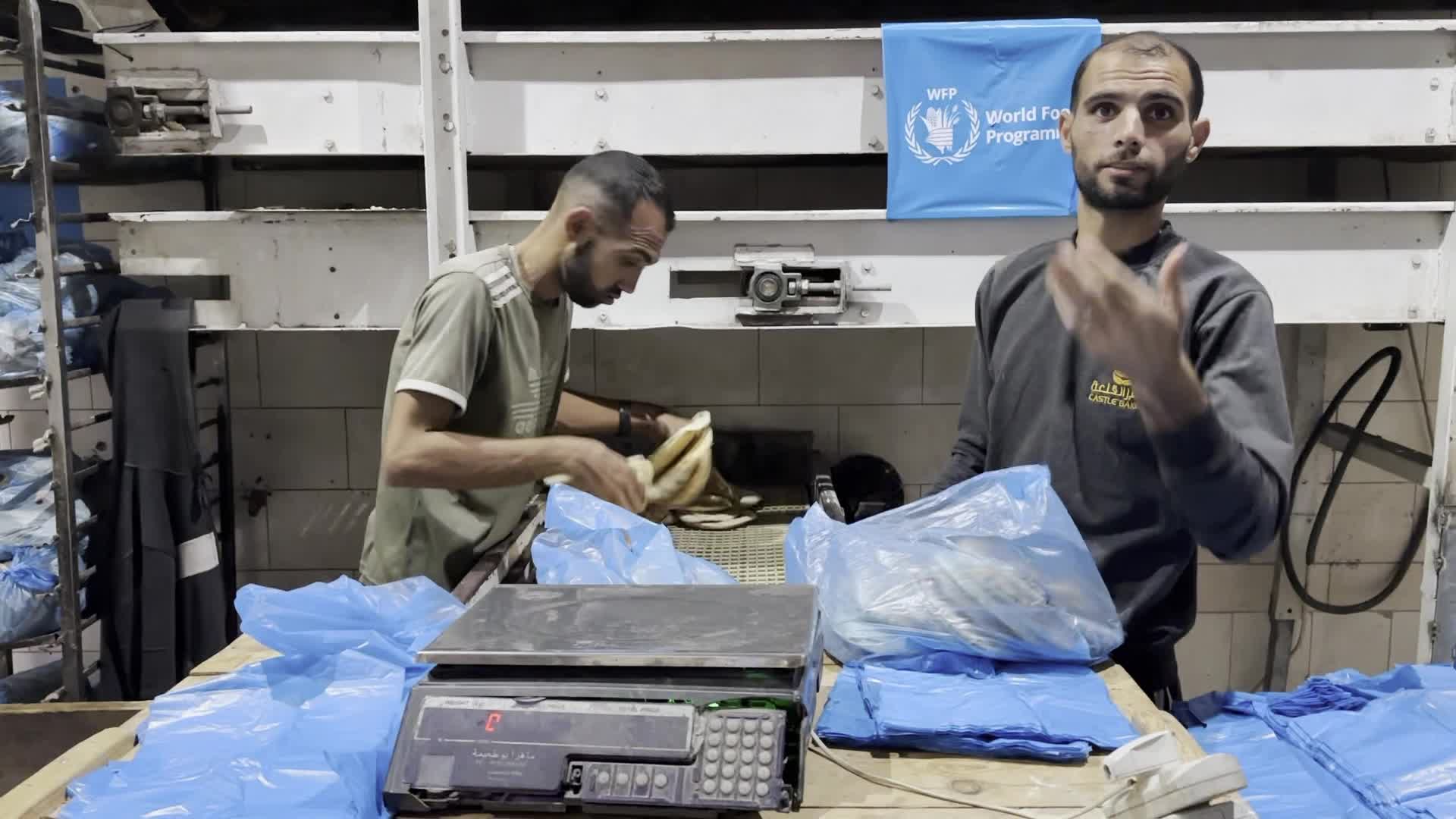Palestinians Queue for Bread at Bakery in Khan Yunis Amid Gaza Conflict