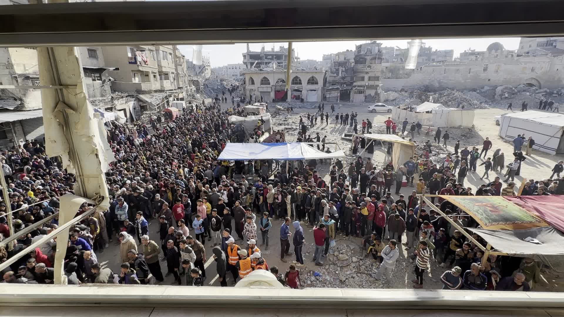 Palestinians Queue for Bread at Bakery in Khan Yunis Amid Gaza Conflict