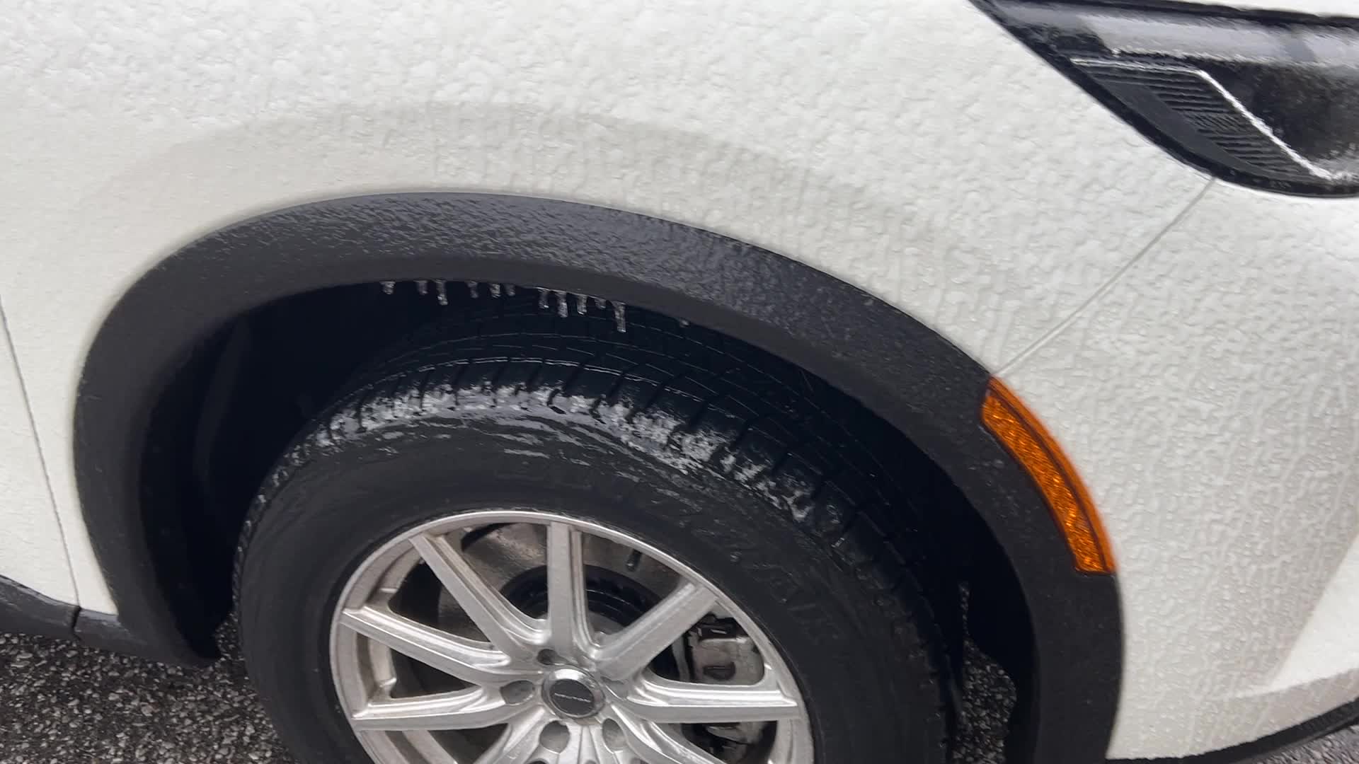 Freezing rain results in surfaces being coated with a sheet of ice in Toronto, Canada