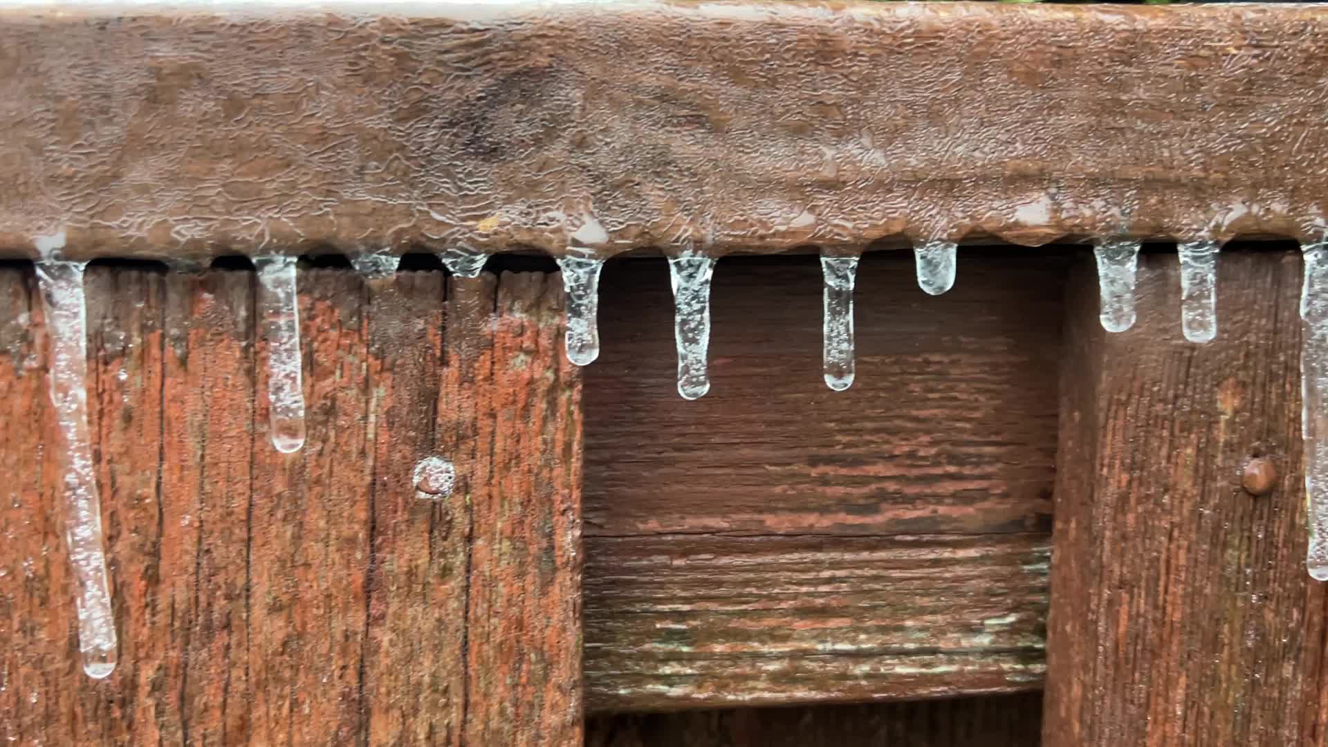 Freezing rain results in surfaces being coated with a sheet of ice in Toronto, Canada