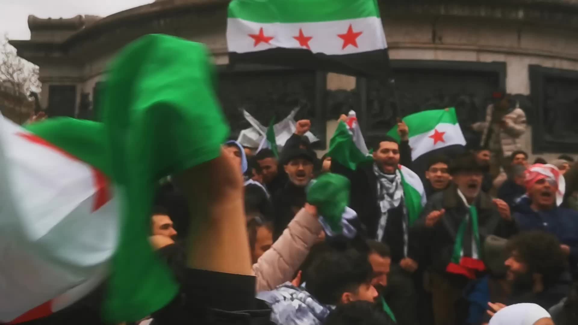 Members of the Syrian community celebrate the fall of Syrian president Bashar al-Assad 