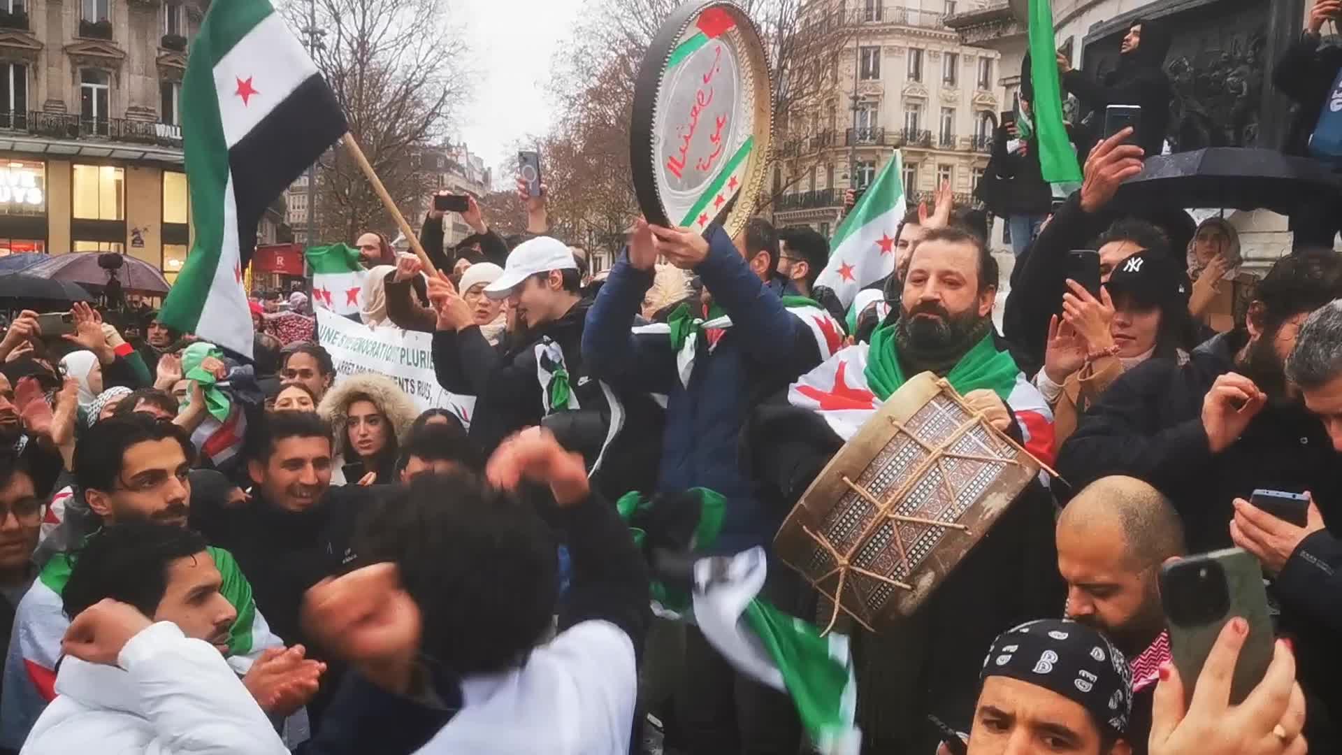 Members of the Syrian community celebrate the fall of Syrian president Bashar al-Assad 