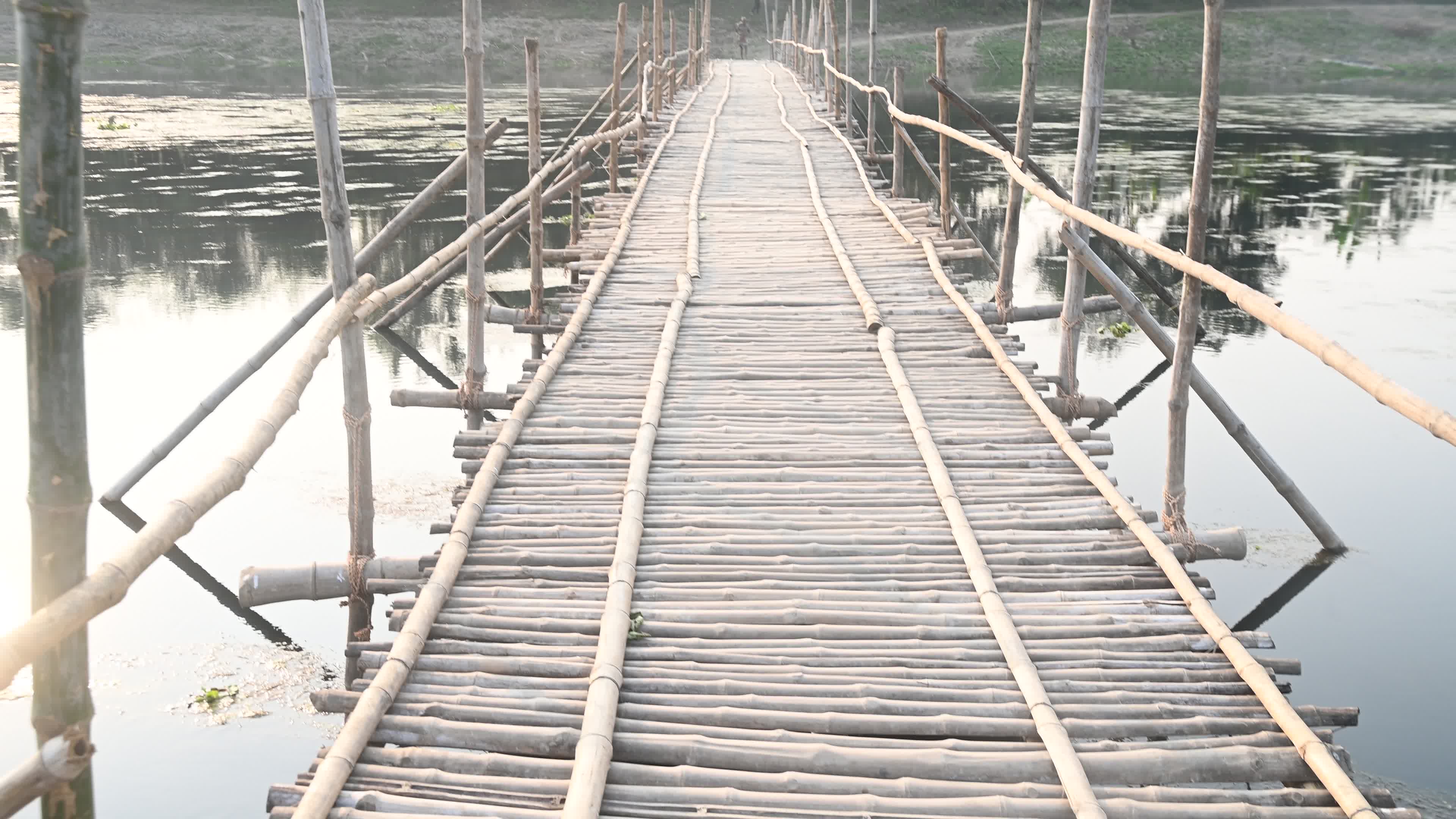 Long Bamboo Bridge Across A River
