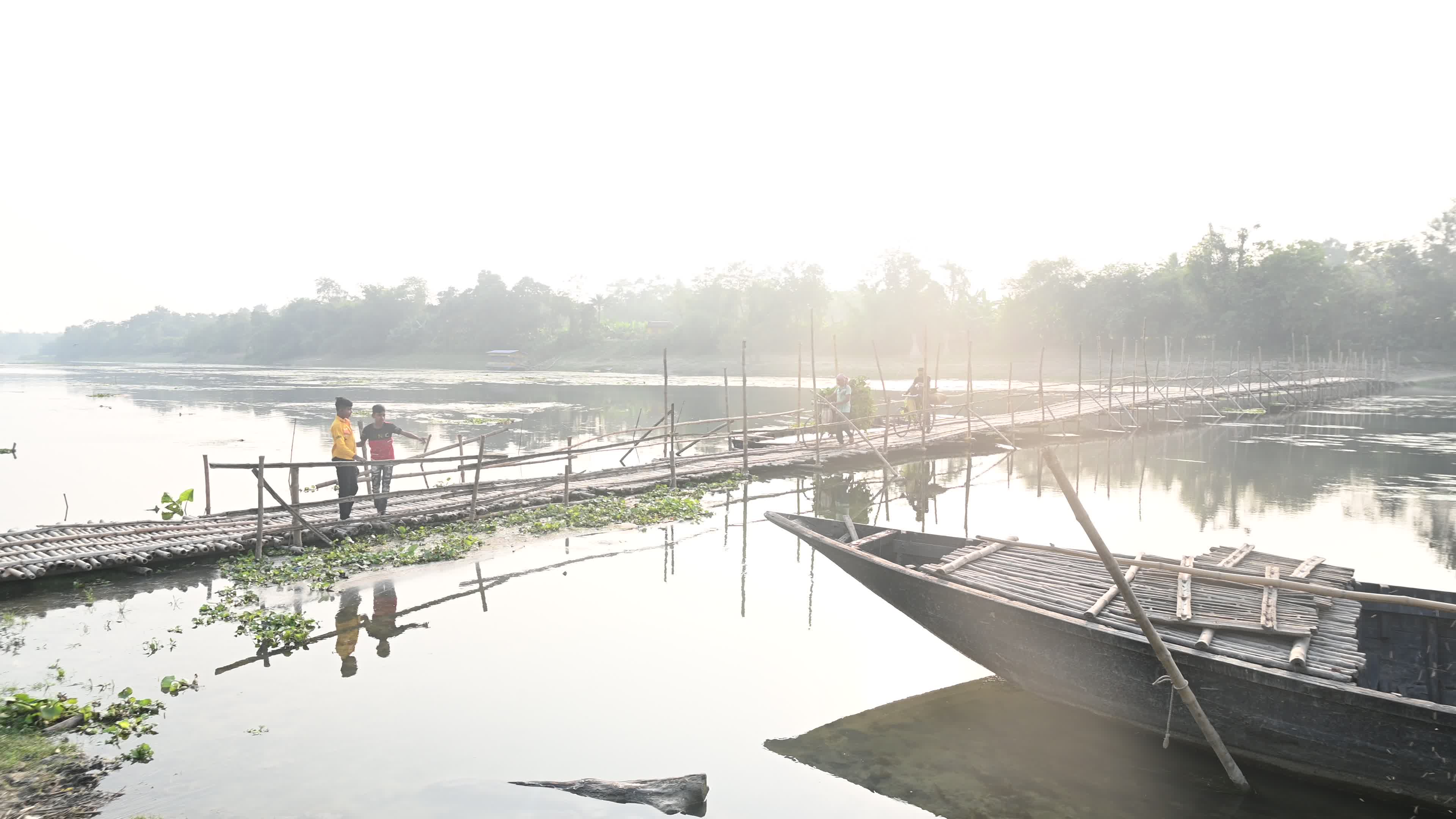 Long Bamboo Bridge Across A River
