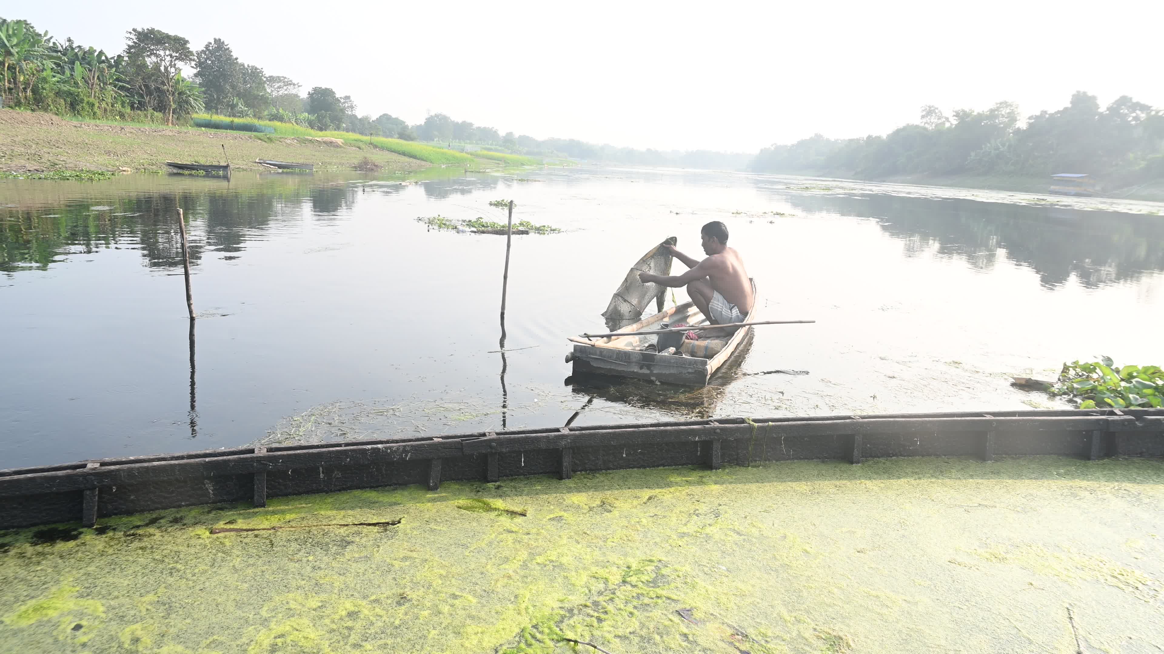 Fisherman catches fish from the river
