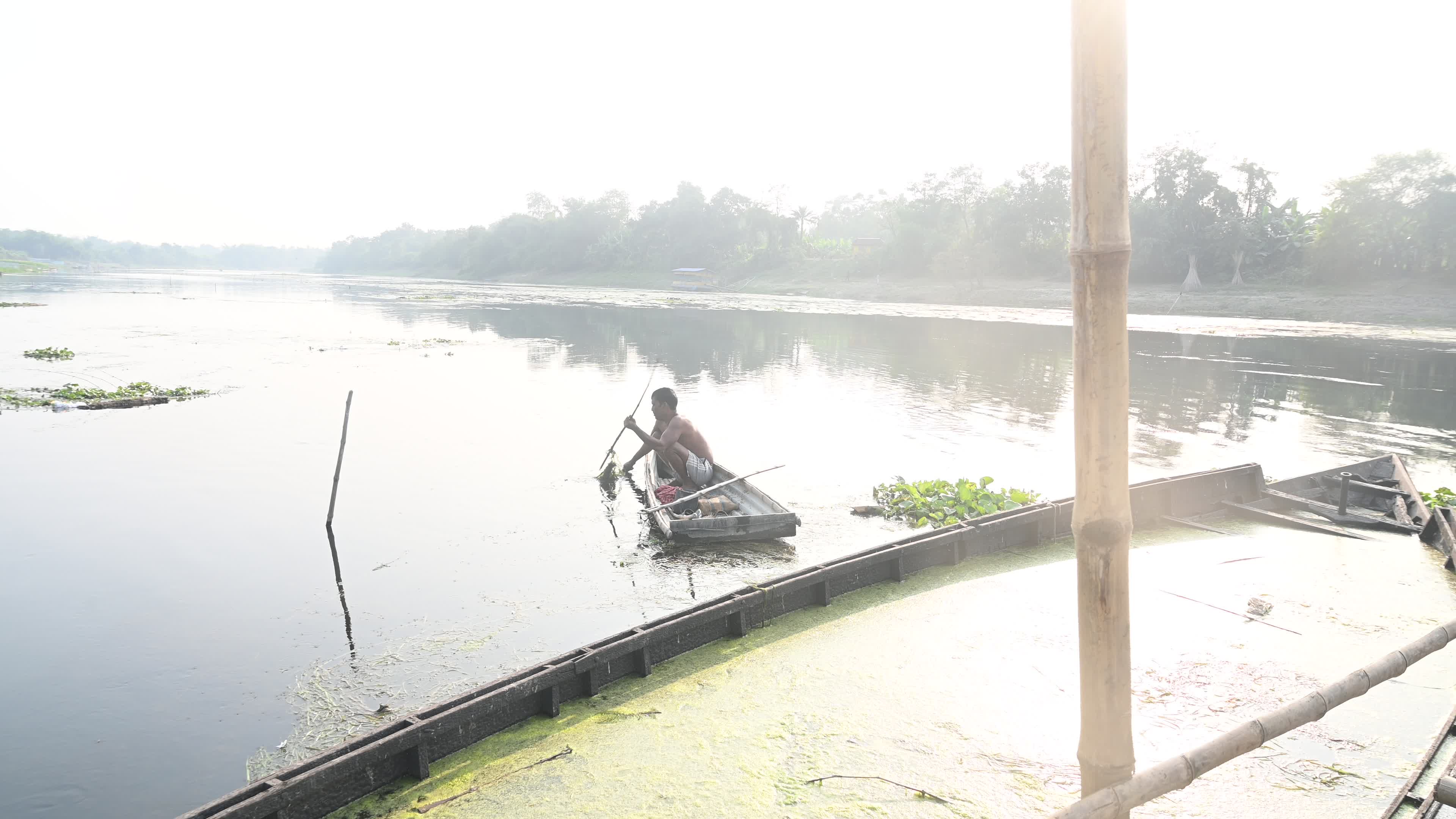 Fisherman catches fish from the river

