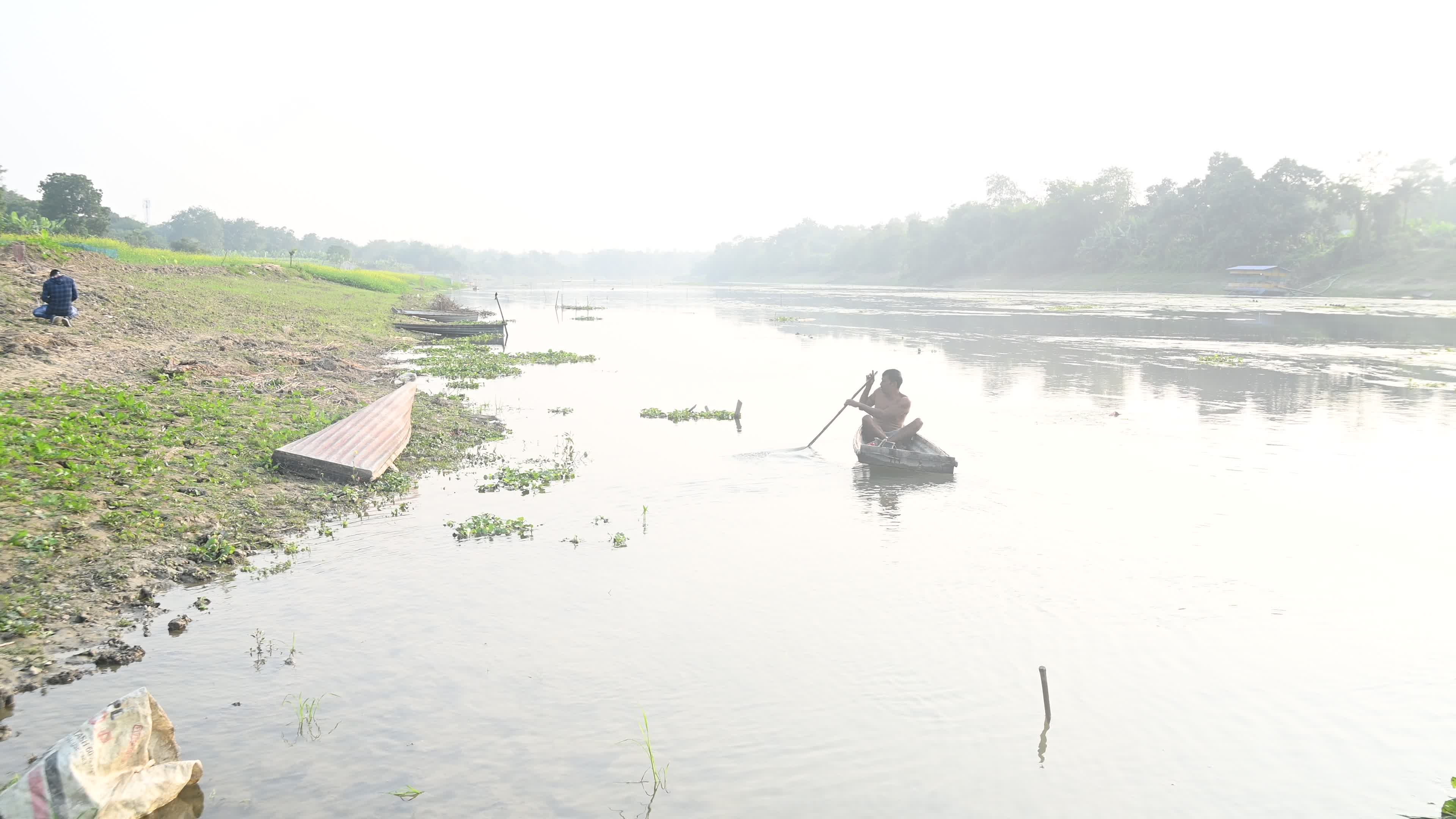 Fisherman catches fish from the river

