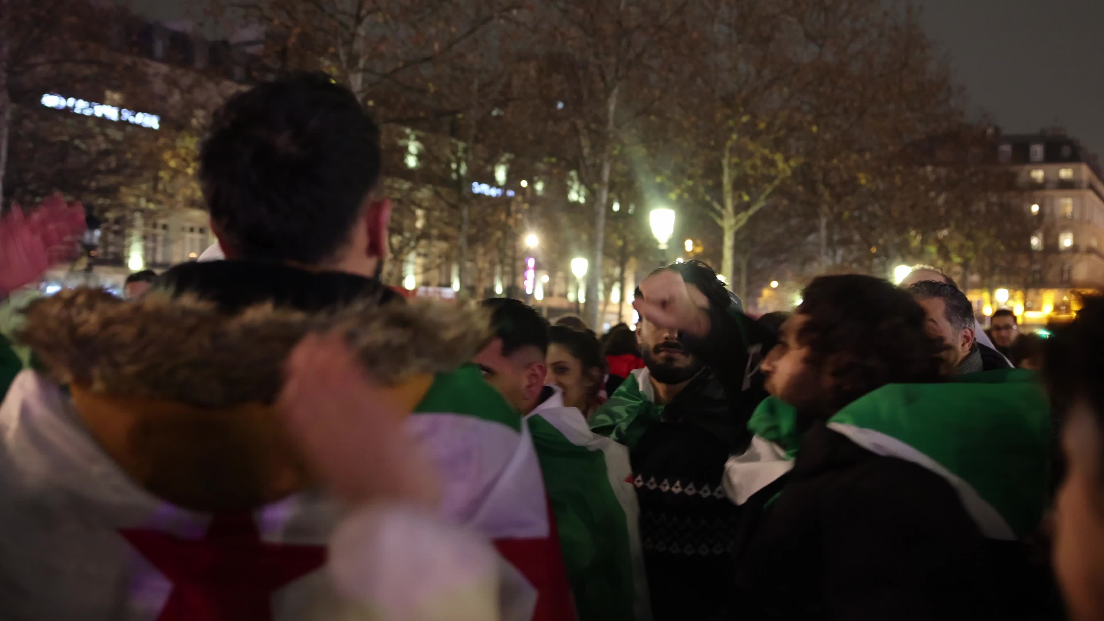 Members of the Syrian community celebrate the fall of Syrian president Bashar al-Assad