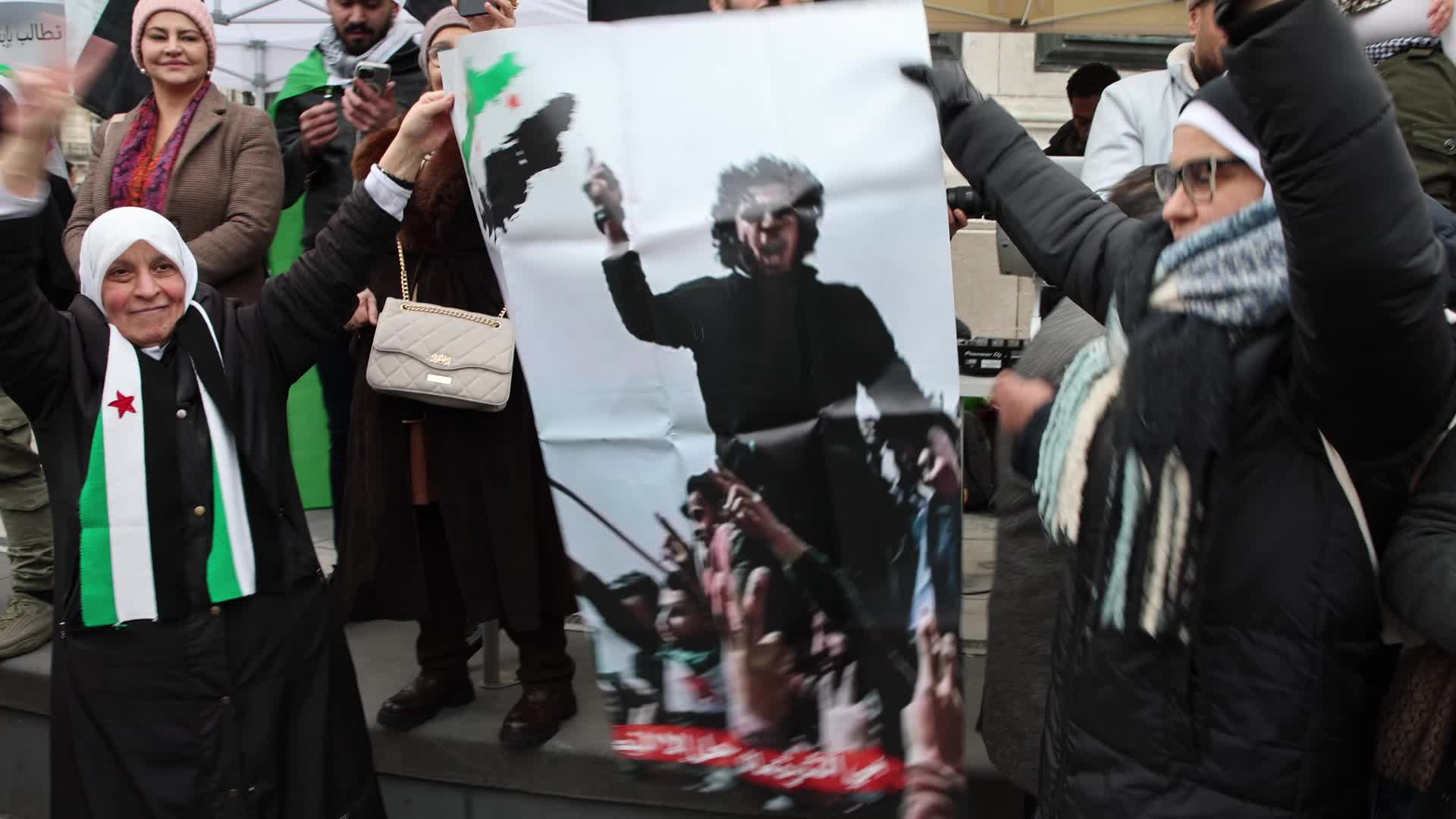 Members of the Syrian community celebrate the fall of Syrian president Bashar al-Assad