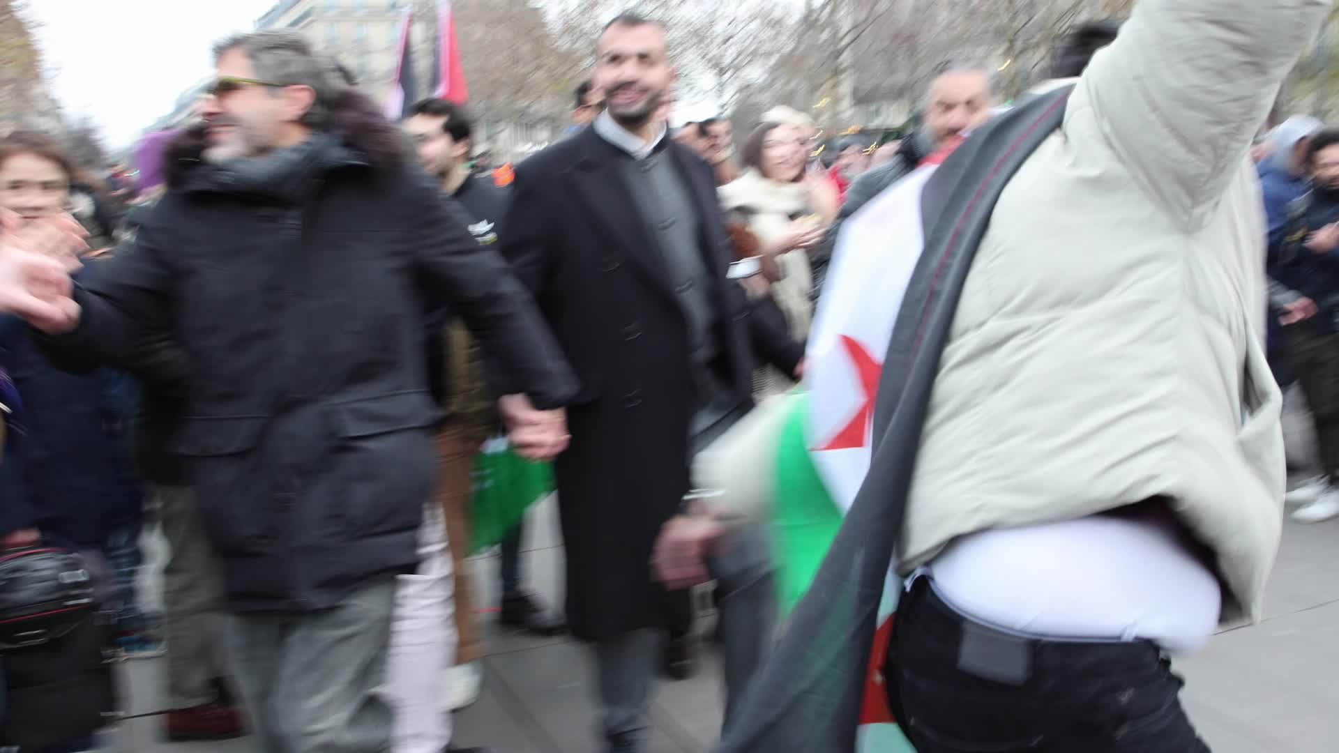 Members of the Syrian community celebrate the fall of Syrian president Bashar al-Assad
