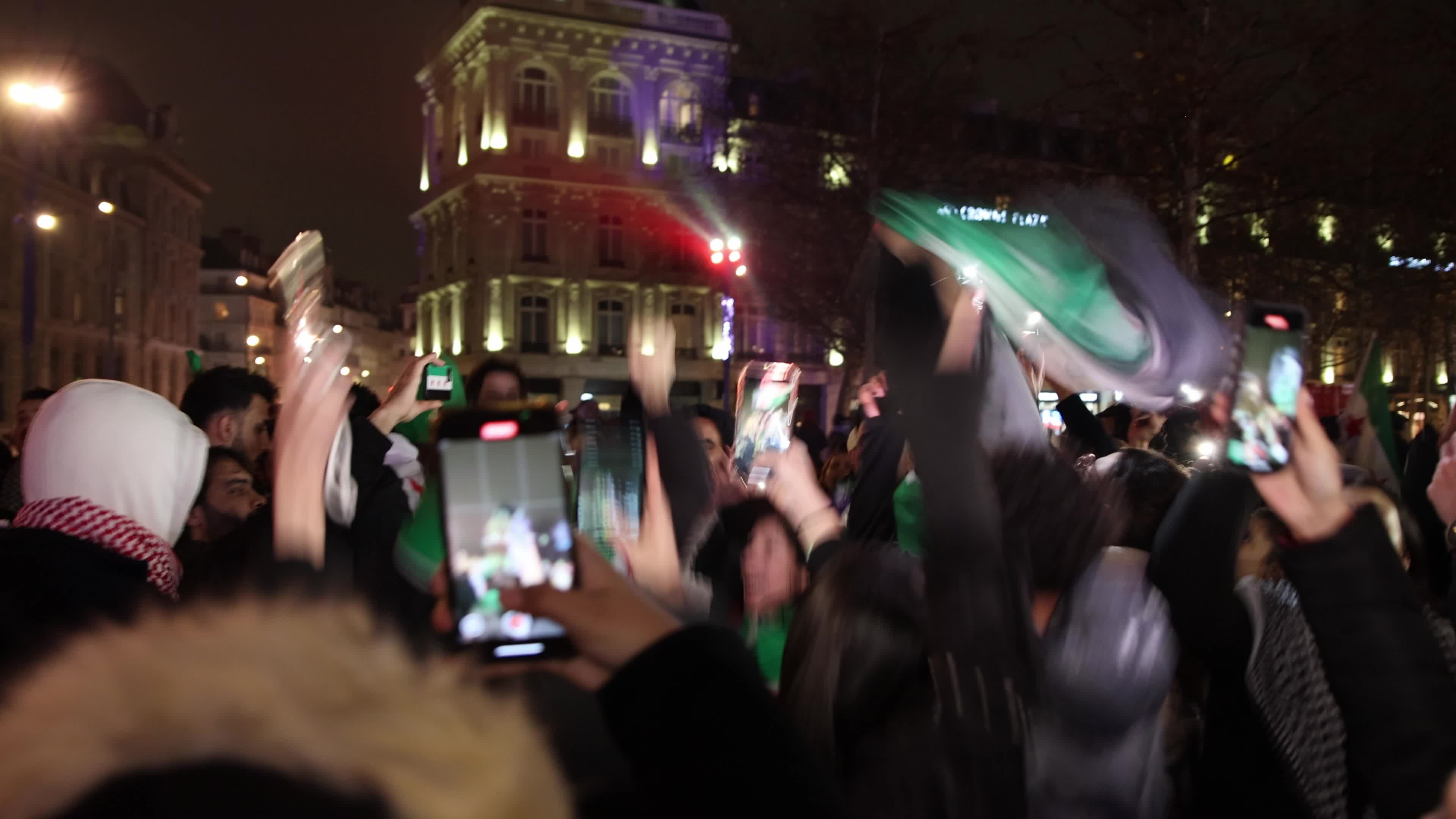 Members of the Syrian community celebrate the fall of Syrian president Bashar al-Assad