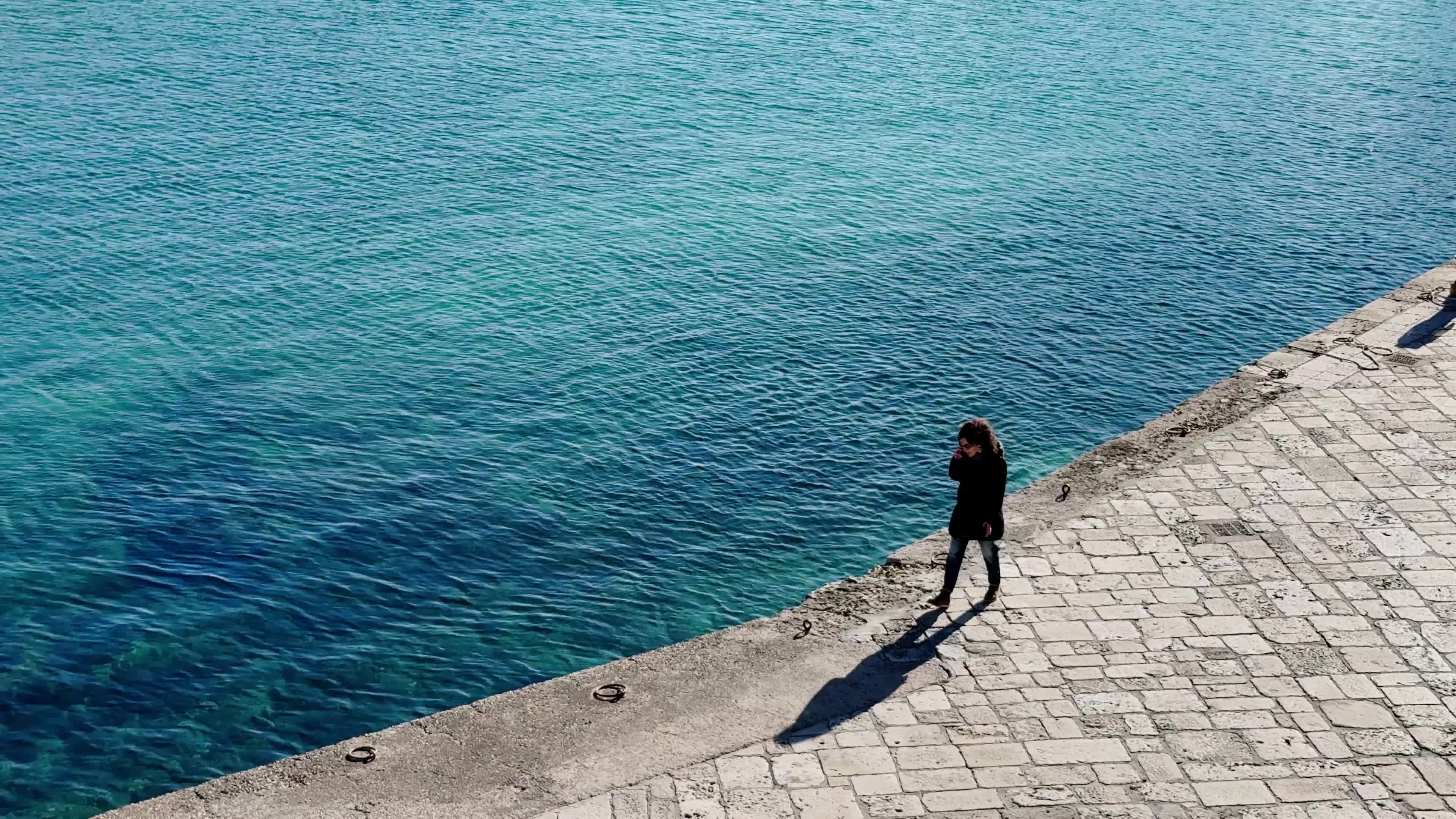 Swimmers Enjoy the Sea in Tricase Porto Amid Mild Winter Weather