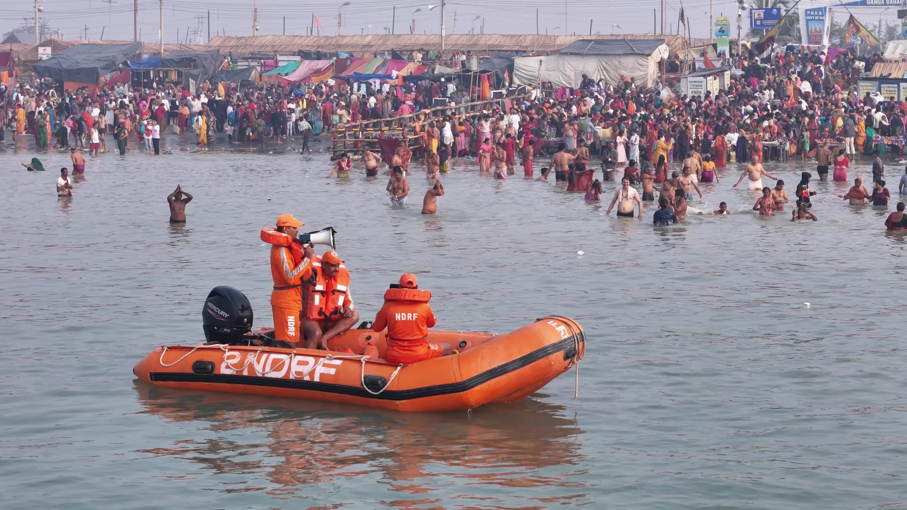 Hindu Pilgrims Taking Holy Dip at Gangasagar Island During Annual Gangasagar Mela