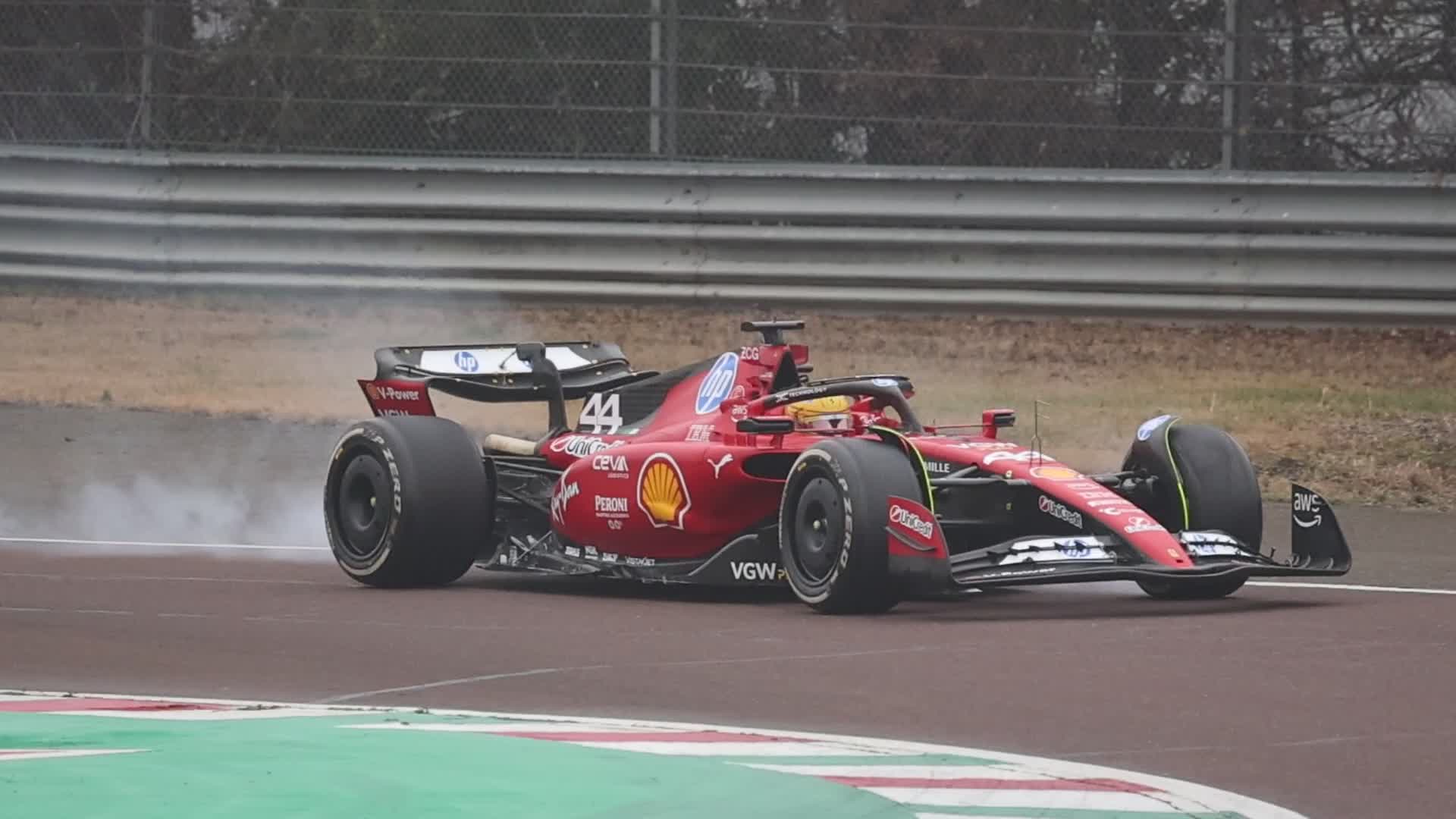 Lewis Hamilton drives on the track during the first day of tests as a Scuderia Ferrari F1 driver at the Fiorano Circuit in Maranello