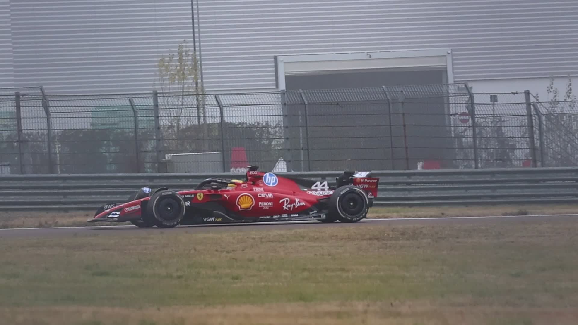 Lewis Hamilton drives on the track during the first day of tests as a Scuderia Ferrari F1 driver at the Fiorano Circuit in Maranello