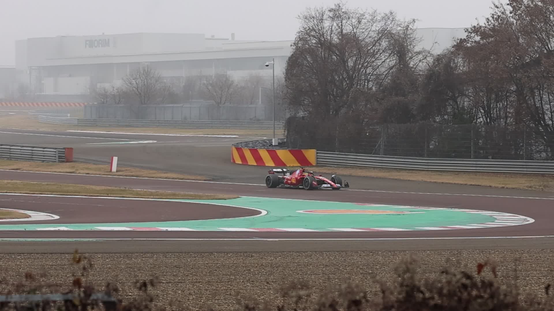 Lewis Hamilton drives on the track during the first day of tests as a Scuderia Ferrari F1 driver at the Fiorano Circuit in Maranello