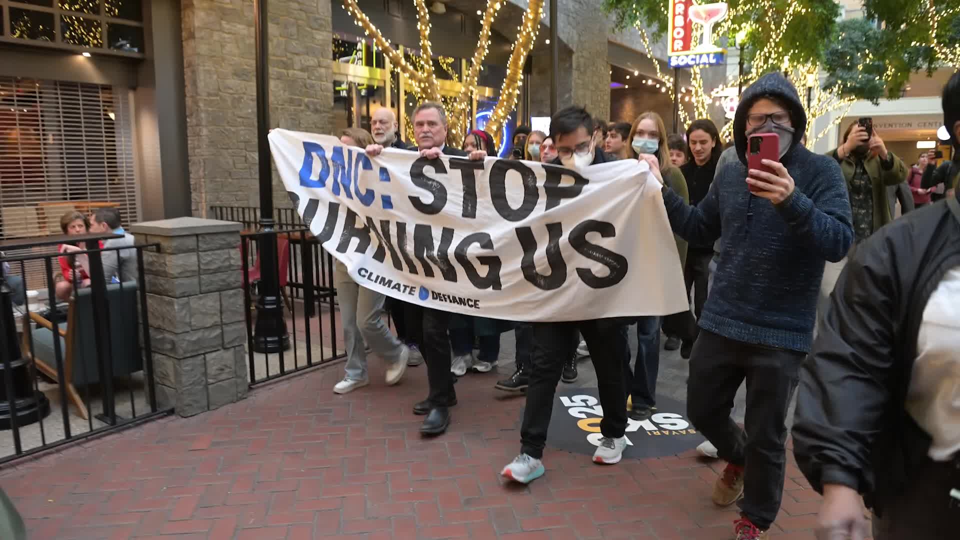 Climate Defiance activists Protest DNC Meeting